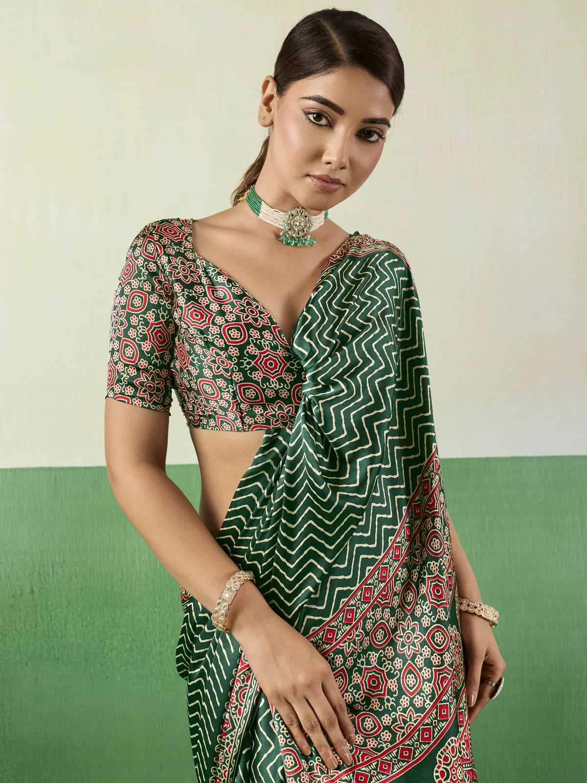 Tarani green modal satin Ajrakh saree closeup view highlighting printed border and blouse design