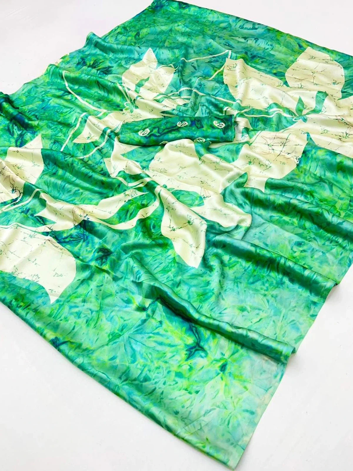 Tarani modal satin saree closeup showing soft texture and abstract floral pattern