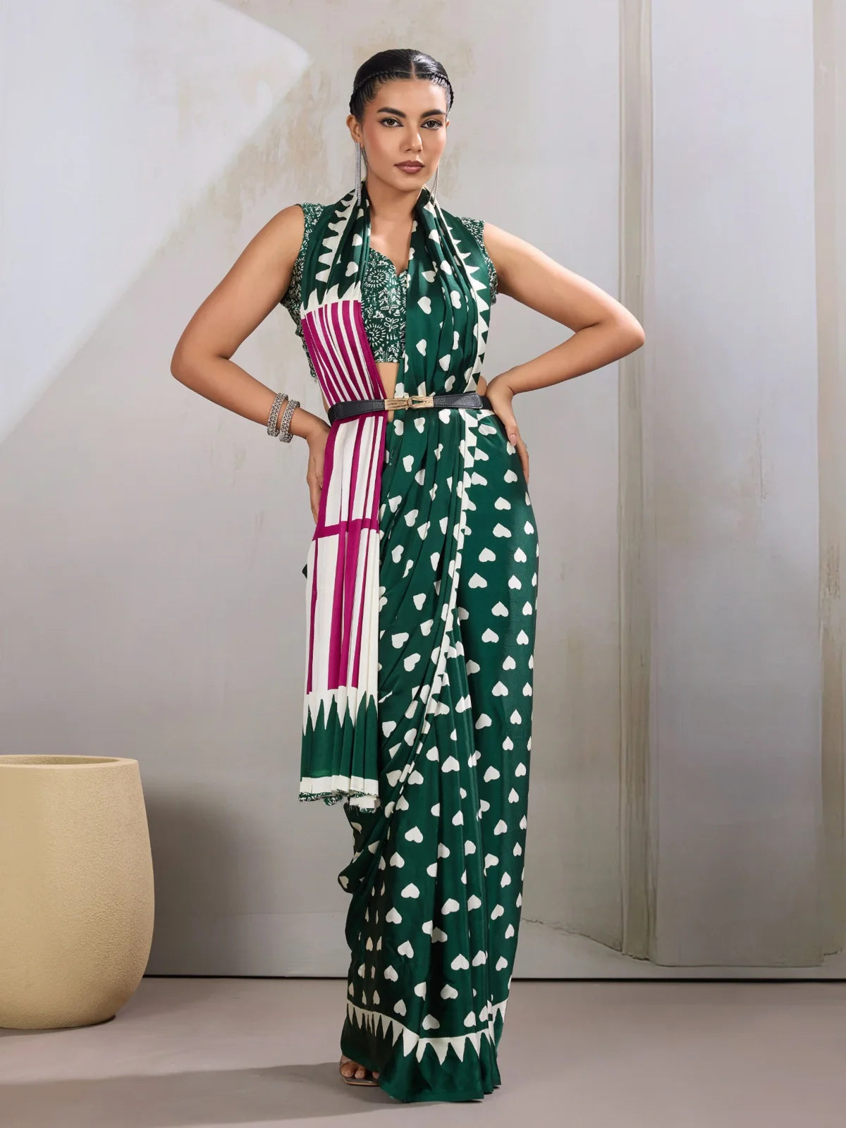 Tarani green modal satin saree with heart-shaped print and contrast pallu shown in full front drape