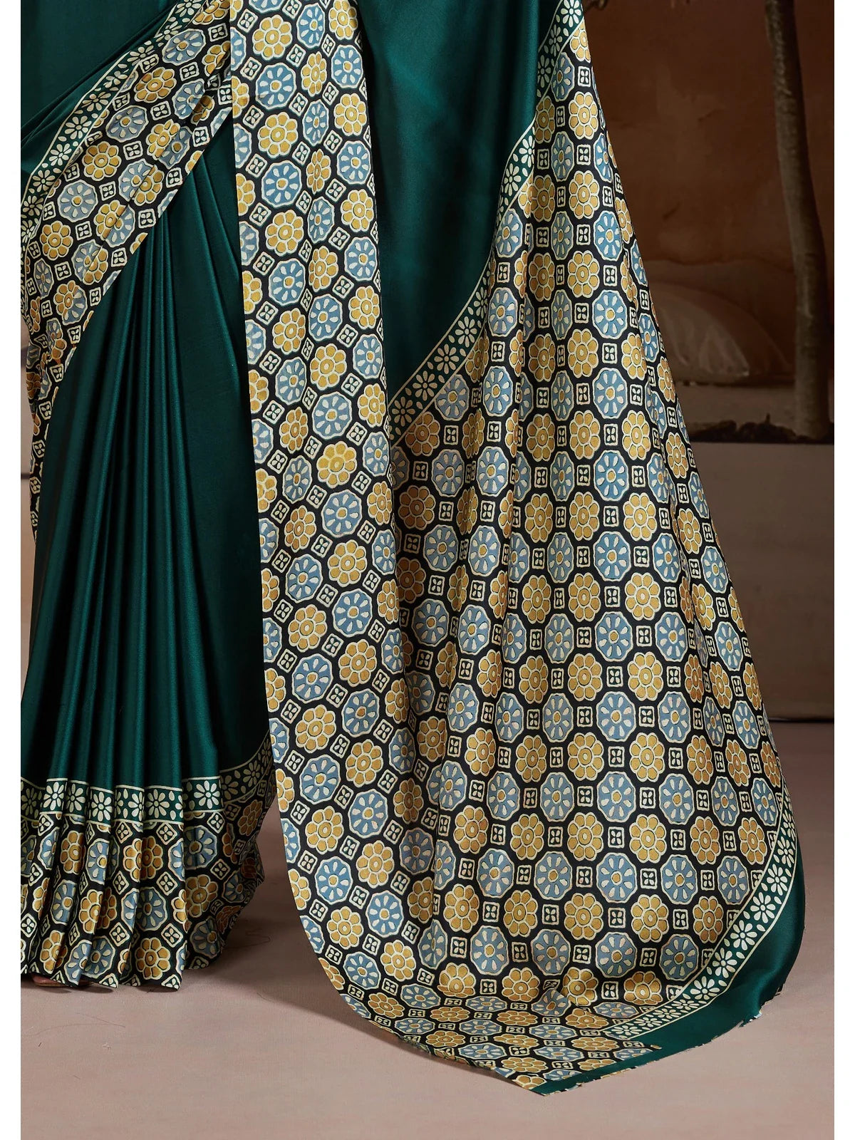 Tarani pallu and border detailing in floral geometric Ajrakh print on green base saree