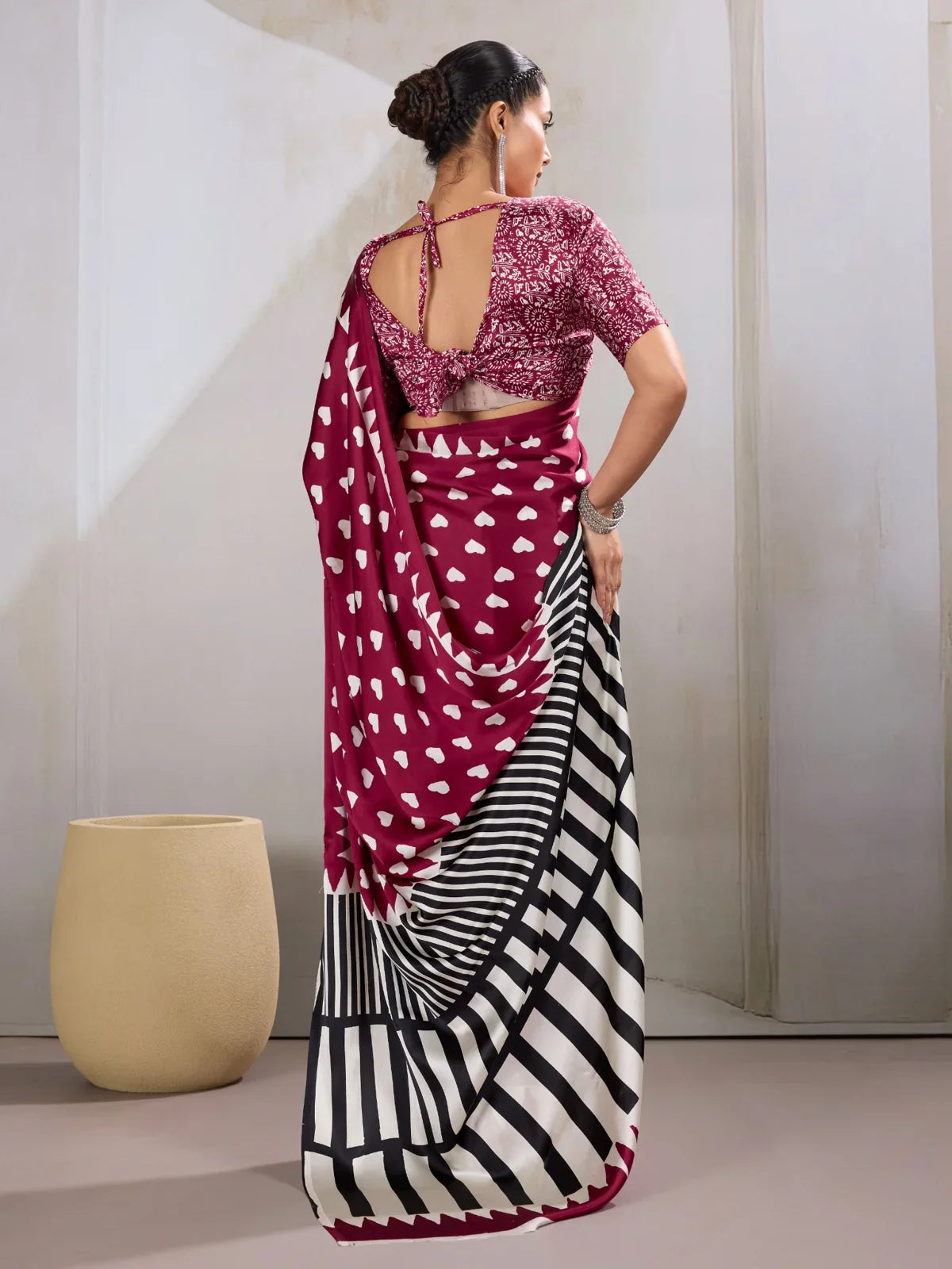 Tarani back view showing blouse tie design and striped pallu flow