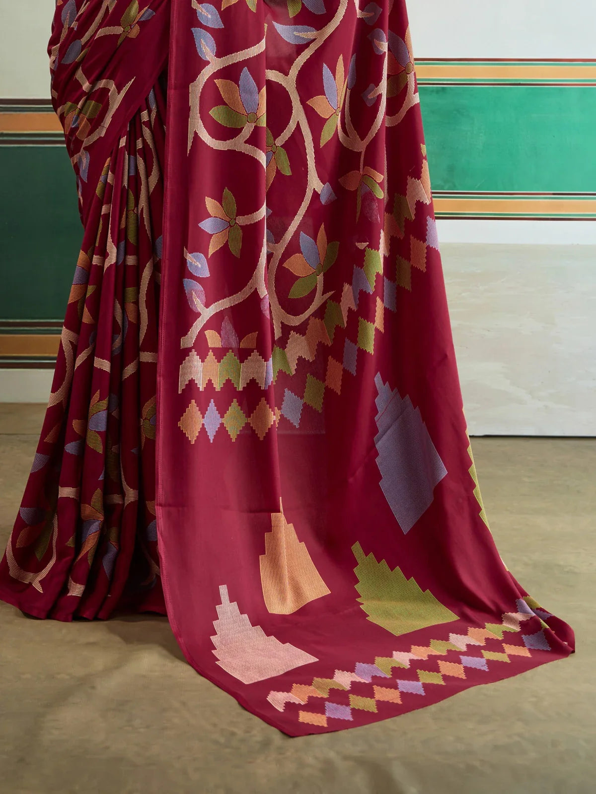 Tarani modal satin saree pallu close-up in maroon with colorful motifs and leaf pattern