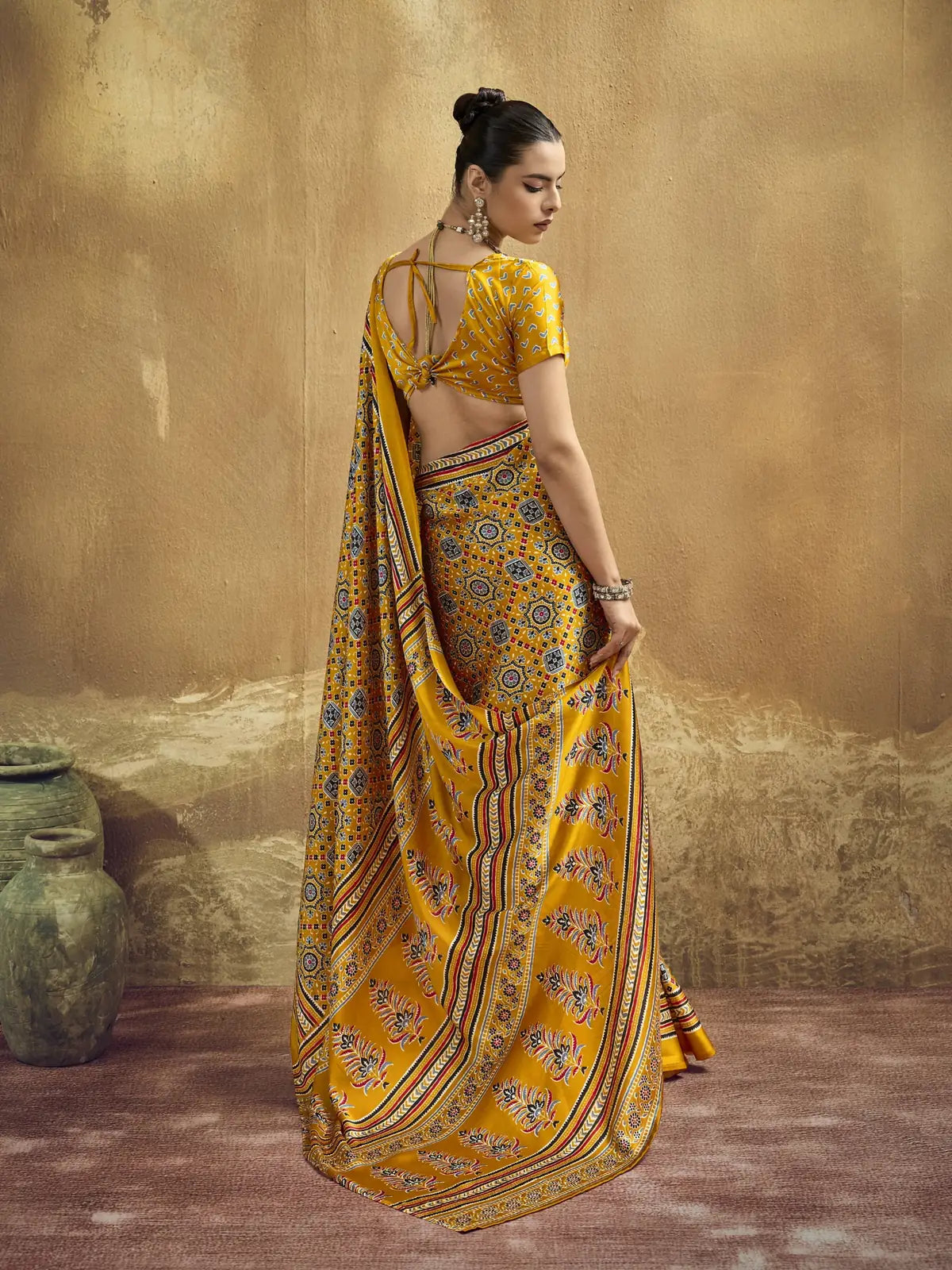 Tarani mustard modal satin Ajrakh print saree elegant back view with pallu