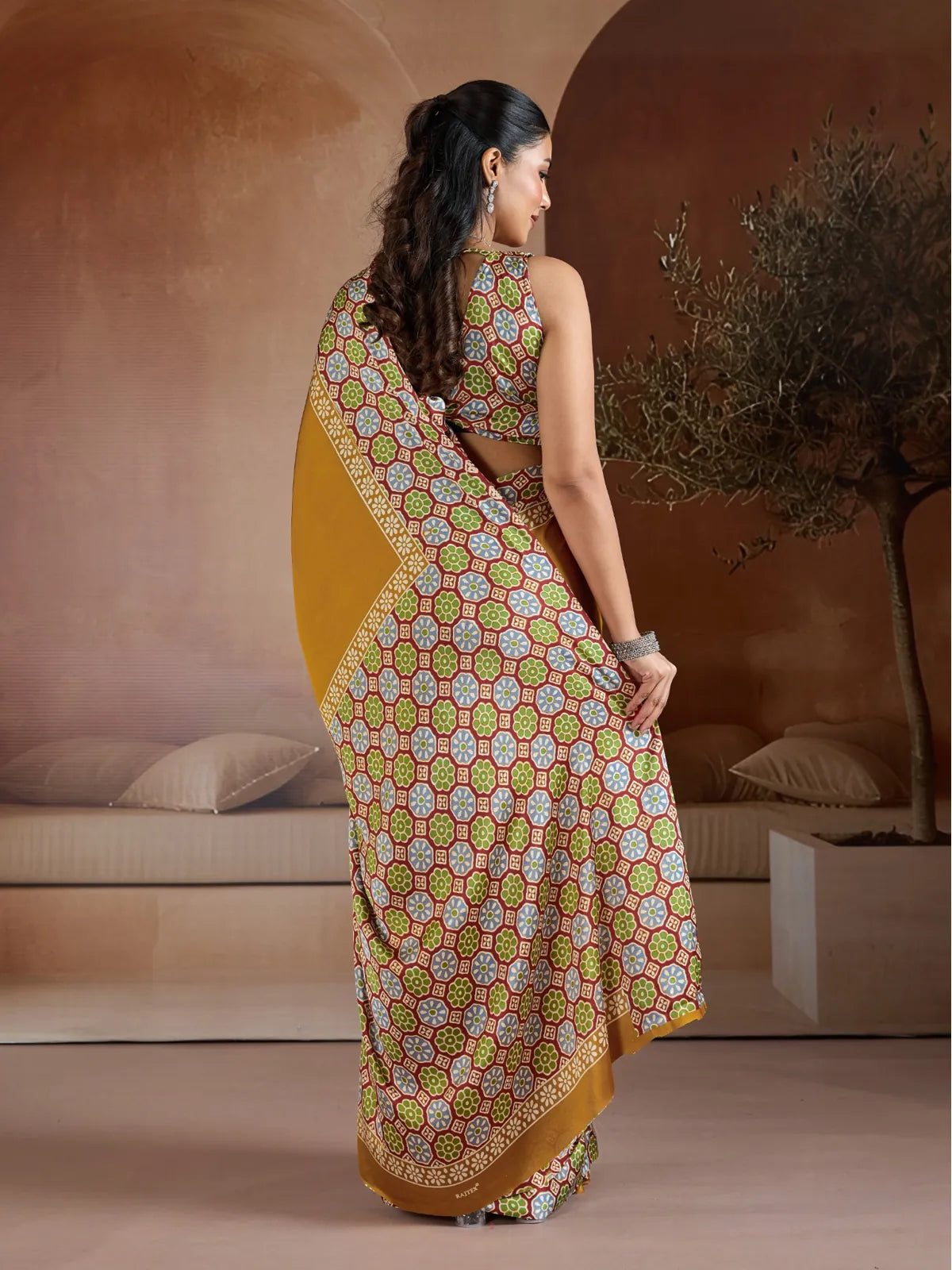 Tarani modal satin saree back view showing blouse back design and flowing printed pallu