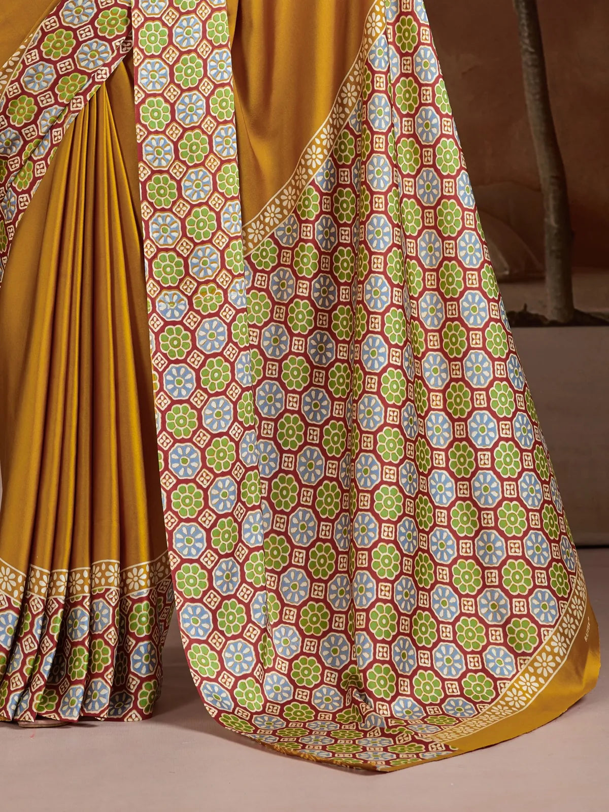 Tarani modal satin saree pallu view with multicolor geometric pattern in blue green and red detailing