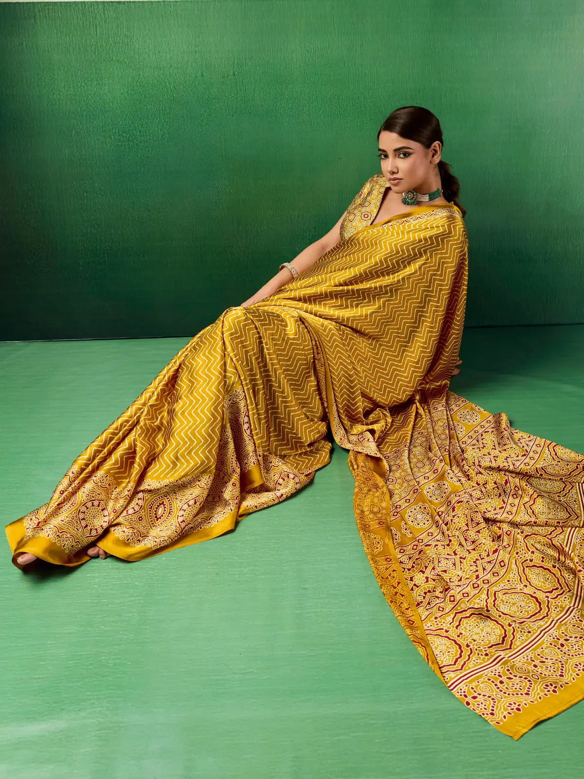 Tarani mustard modal satin saree side pose showcasing rich Ajrakh printed drape and border