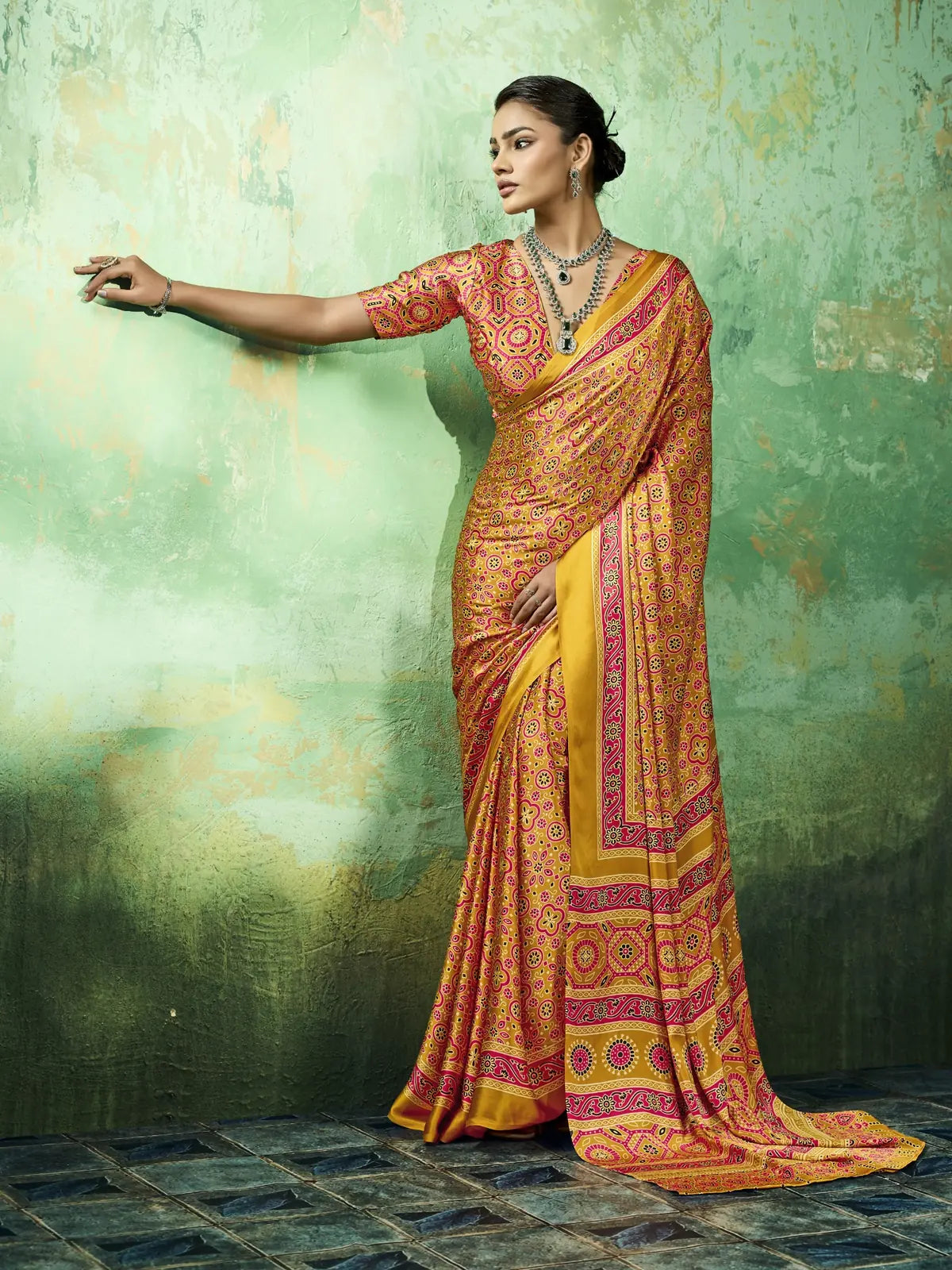 Tarani mustard Ajrakh print saree side pose showcasing graceful drape and border