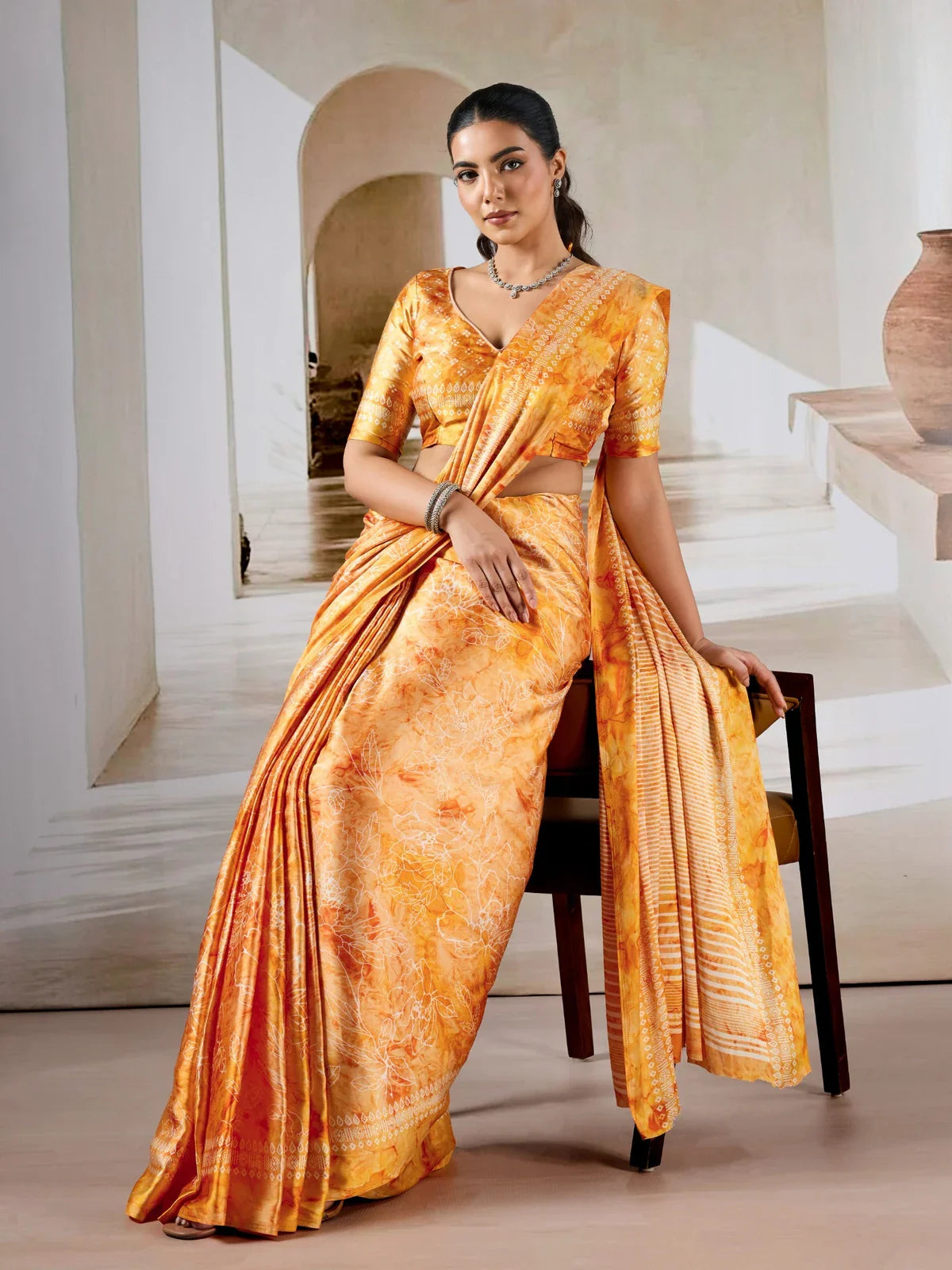 Tarani orange modal satin saree with ajrakh and prism print in full draped front view