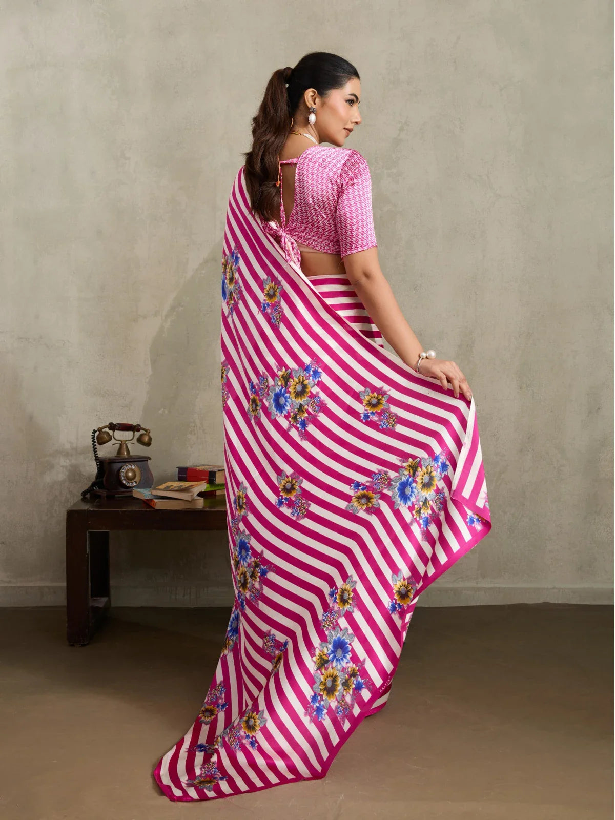 Tarani saree back view with floral pallu and blouse tie-up design in pink modal satin