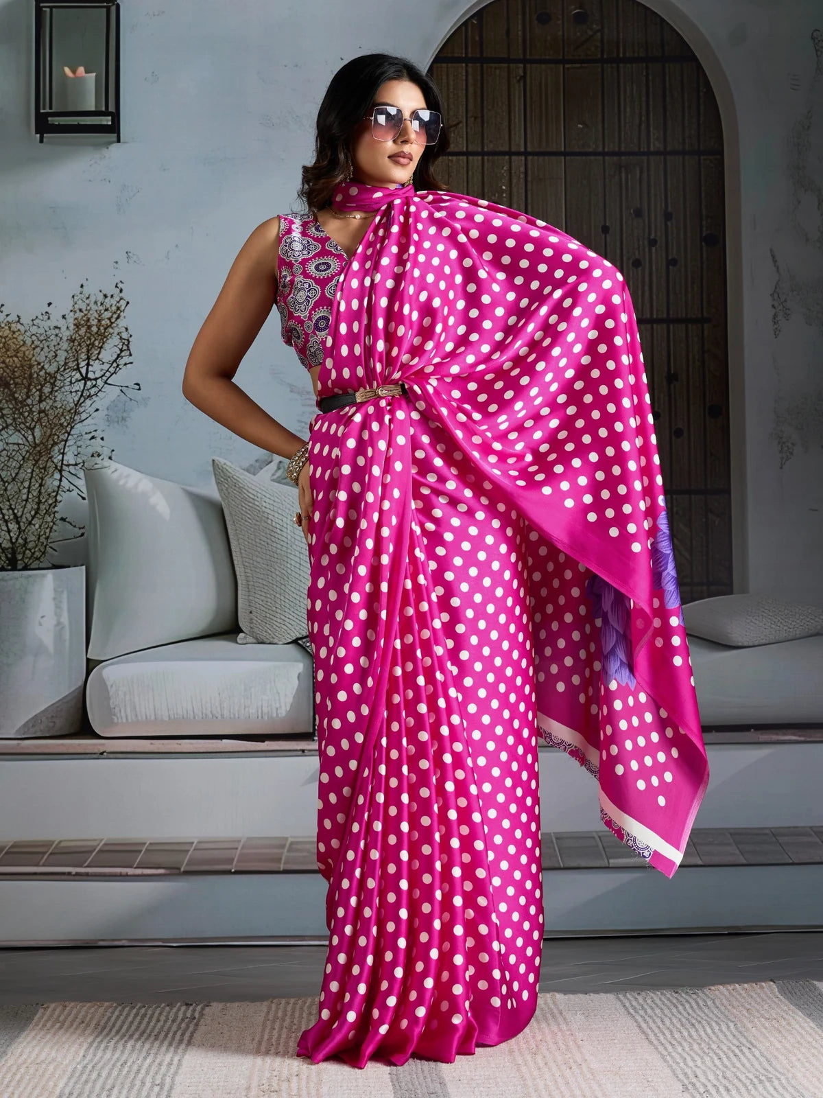 Tarani pink modal satin polka dot saree with stylish drape front pose for party wear