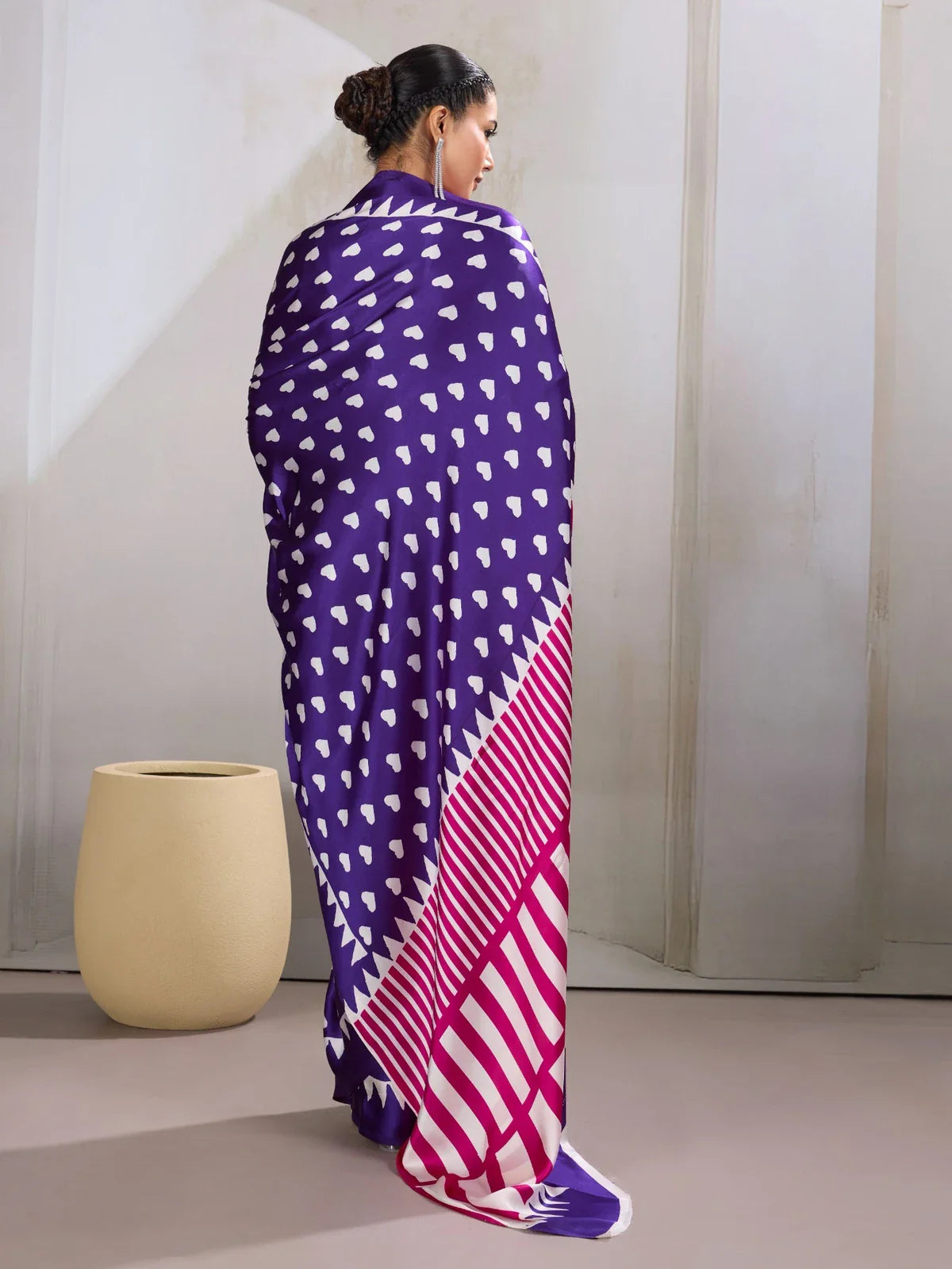 Tarani purple saree with white heart motifs in full back view showing flowing pallu