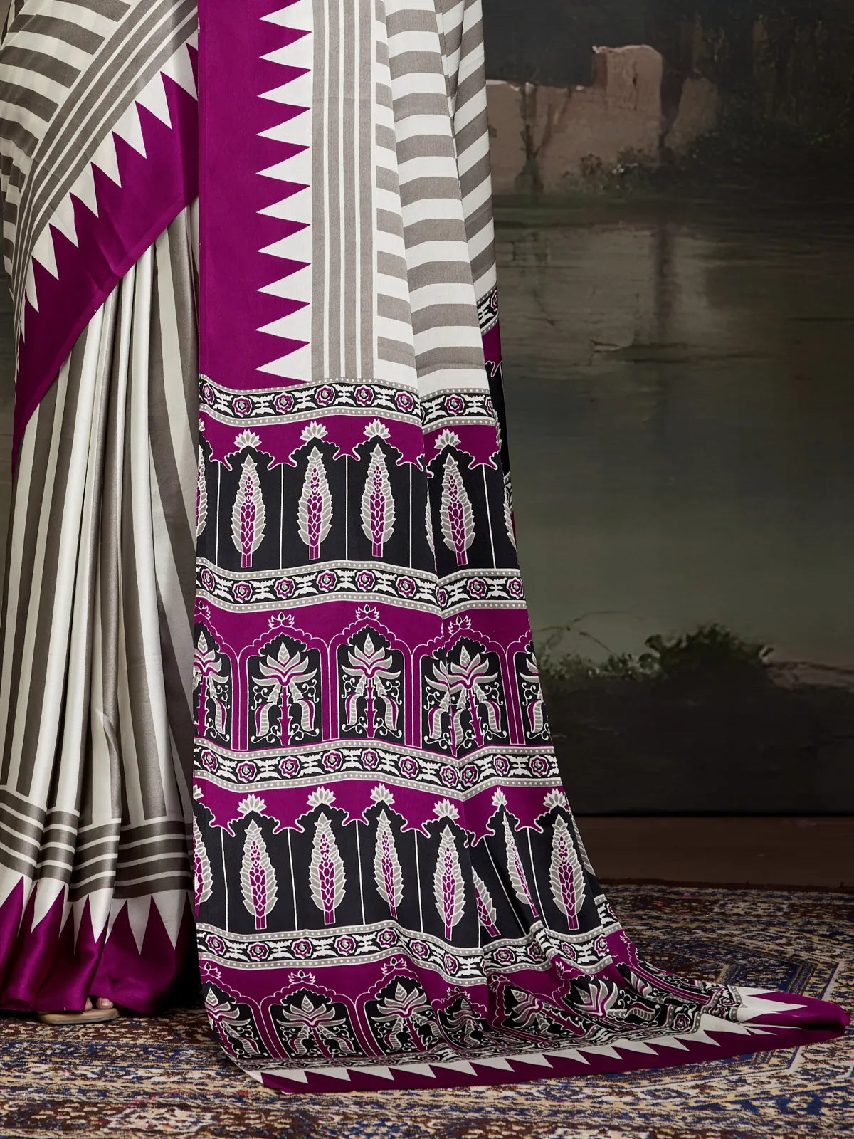 Tarani closeup view of pallu and lower pleats in ajrakh modal satin saree with geometric and floral motifs