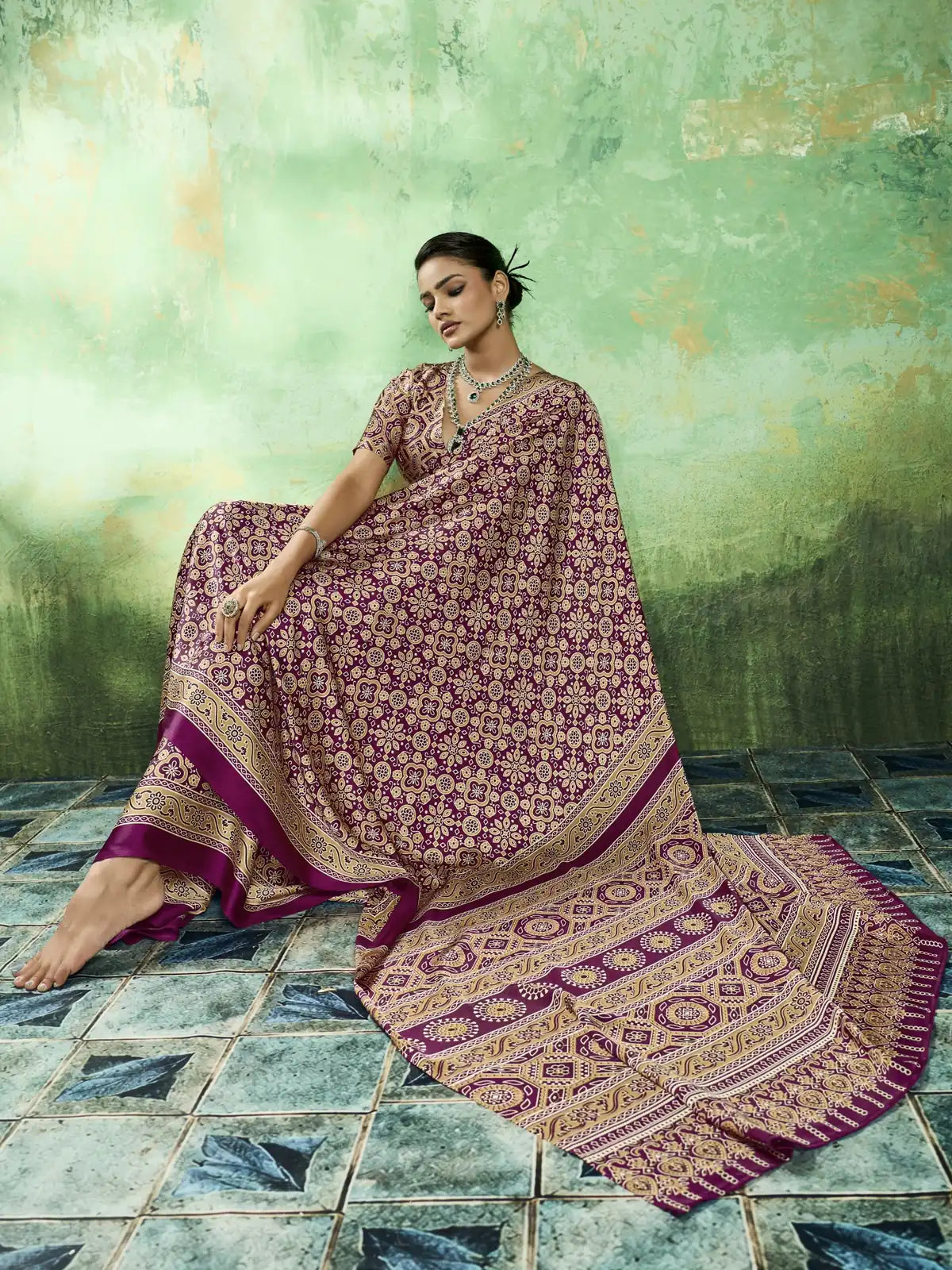 Tarani wine modal satin saree pallu view with intricate Ajrakh border detailing