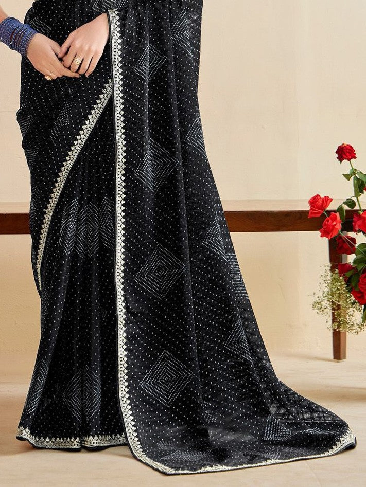 Tarani black moss chiffon silk saree pallu view showing bandhani work and embroidered lace border