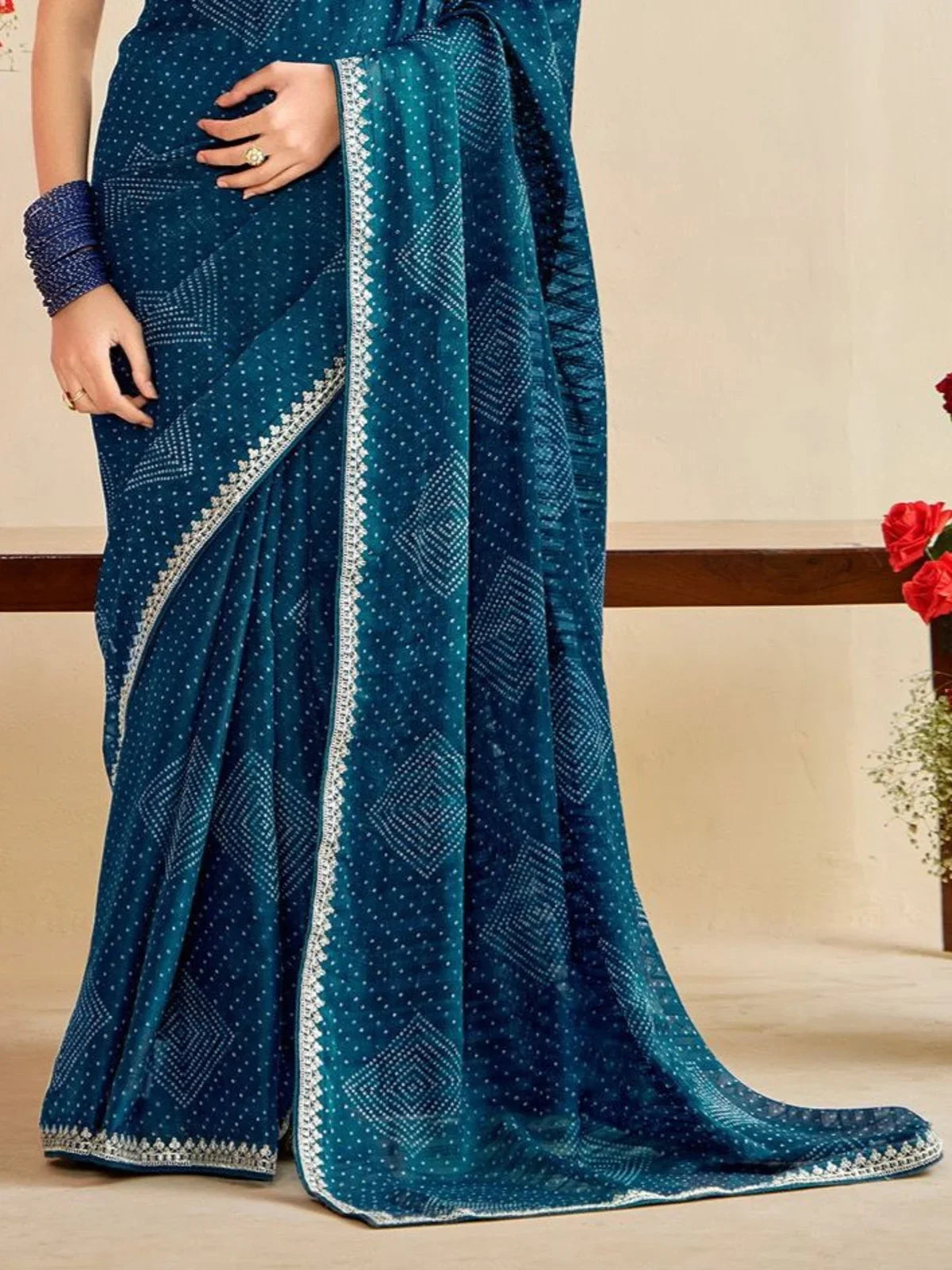 Tarani teal moss chiffon silk saree pallu view showing intricate lace border