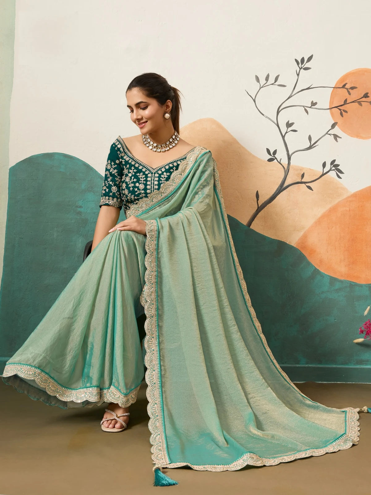 Tarani sea green festive saree with scalloped border and flowing pallu front view