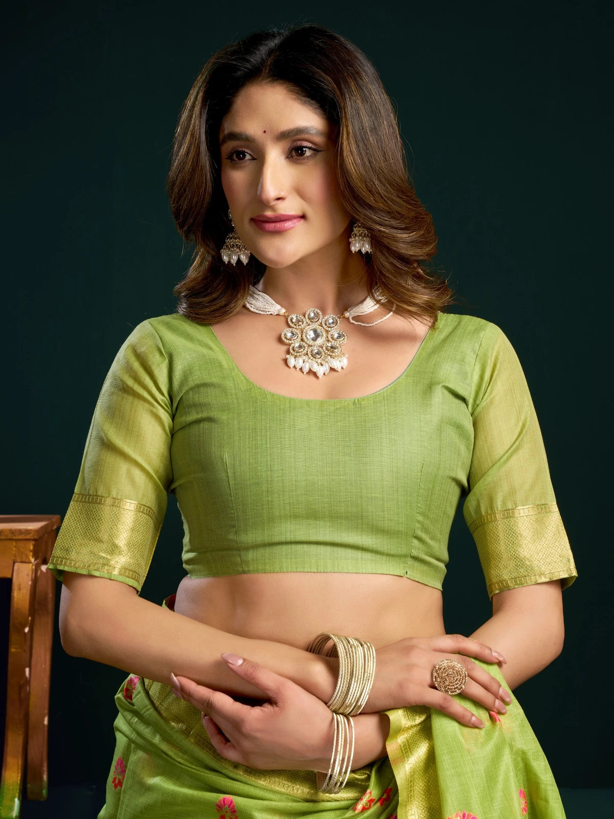 Tarani green Munga Cotton Mina Work saree upper body view showing zari blouse and elegant drape