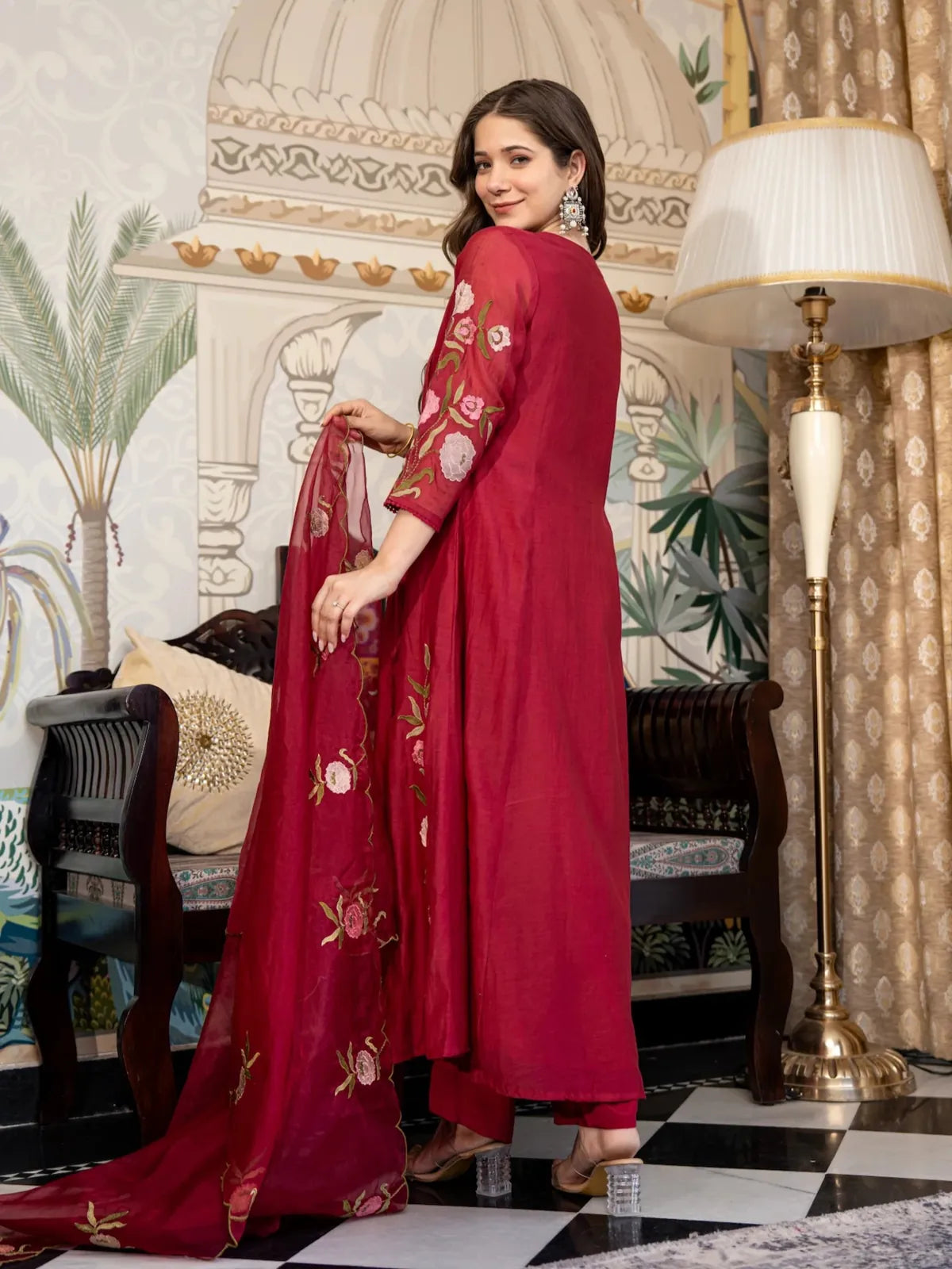 Back view of Tarani festive maroon muslin dress with floral embroidery on sleeves and dupatta