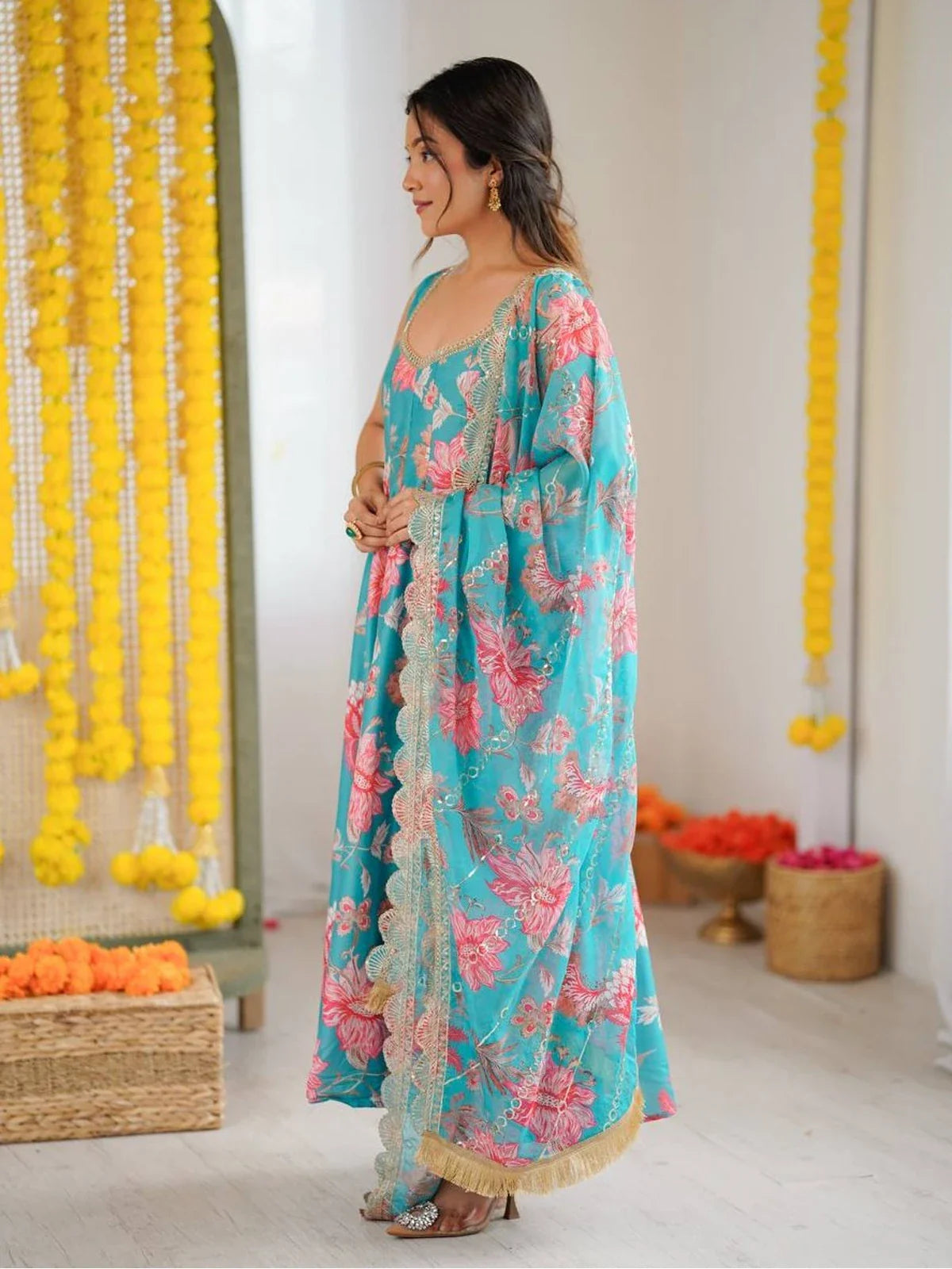 Tarani turquoise muslin Anarkali dress side view with organza dupatta and floral pattern