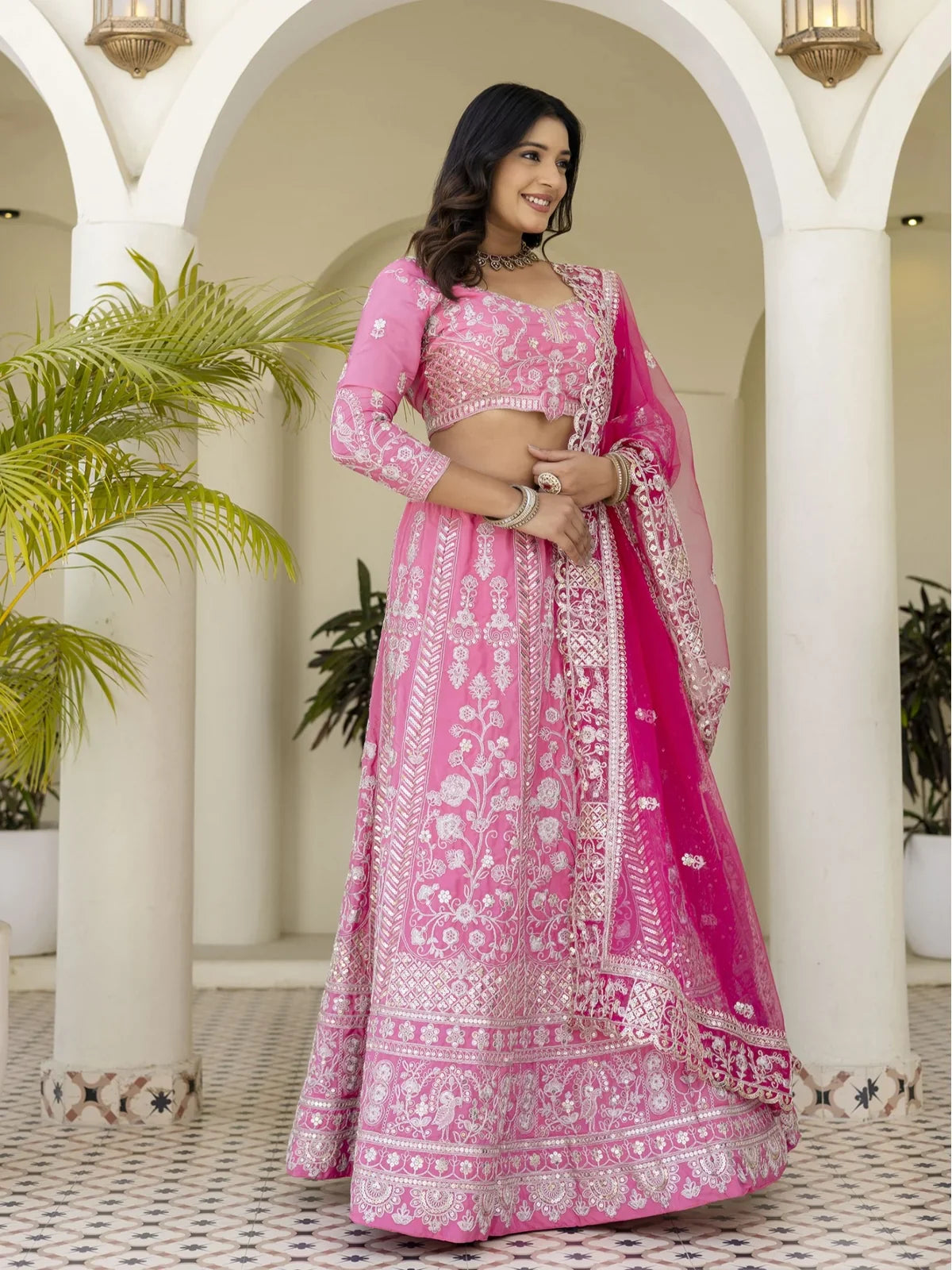 Tarani pink bridal lehenga in crap silk showing detailed wedding look from the front