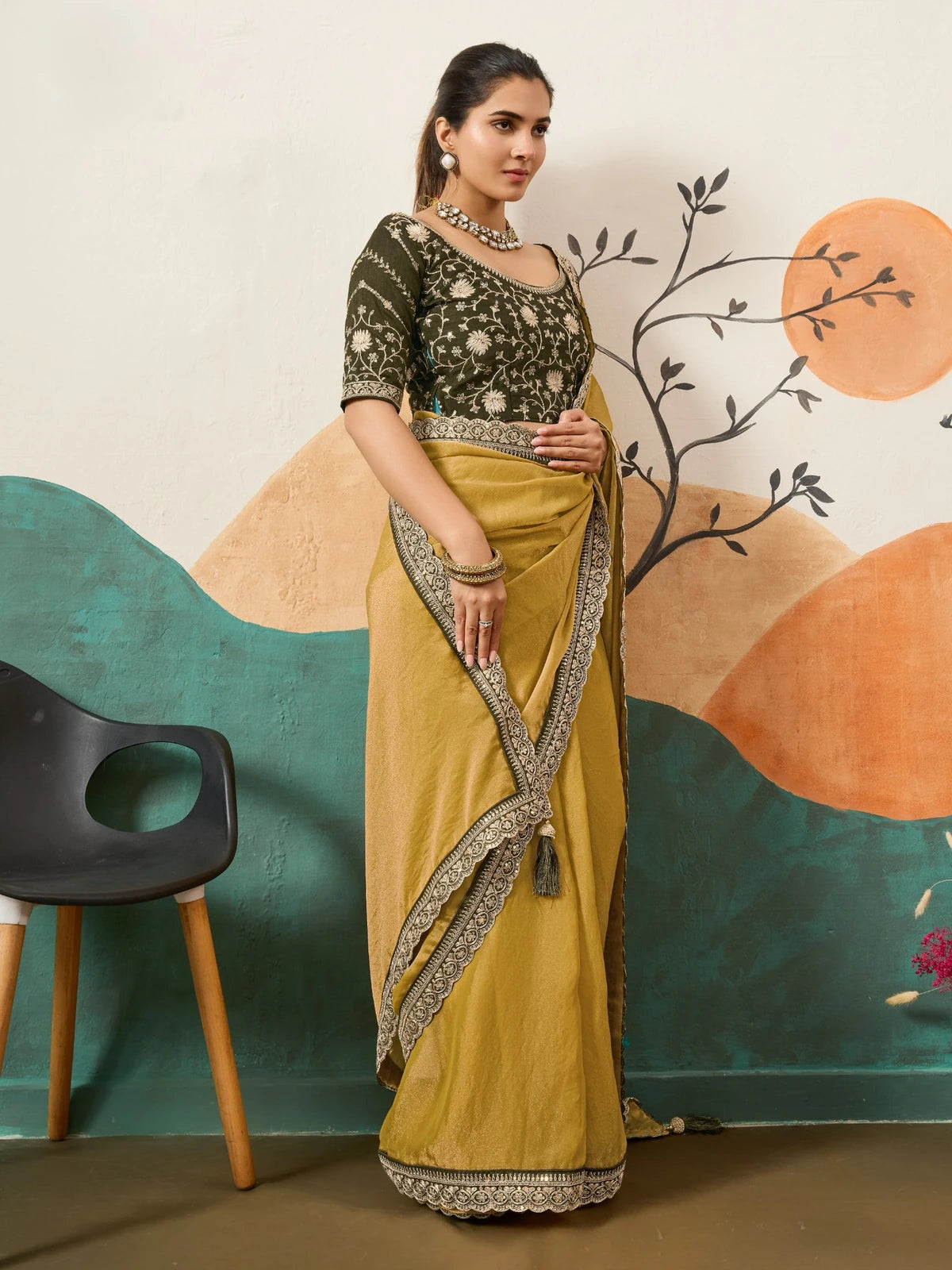 Tarani mustard saree side view with embroidered blouse and detailed designer border styling
