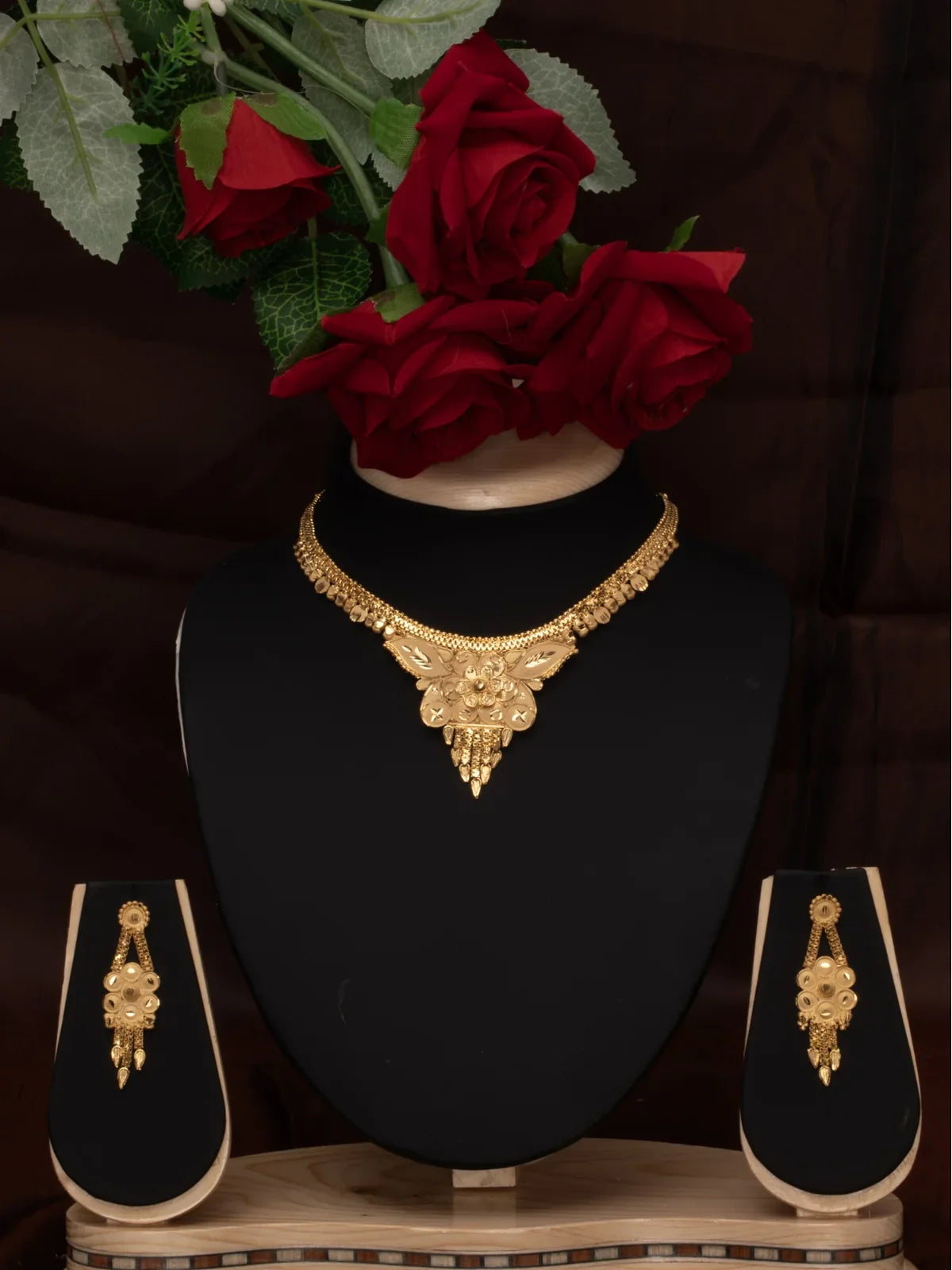 Tarani gold plated necklace set with floral design and matching earrings for weddings and festive occasions