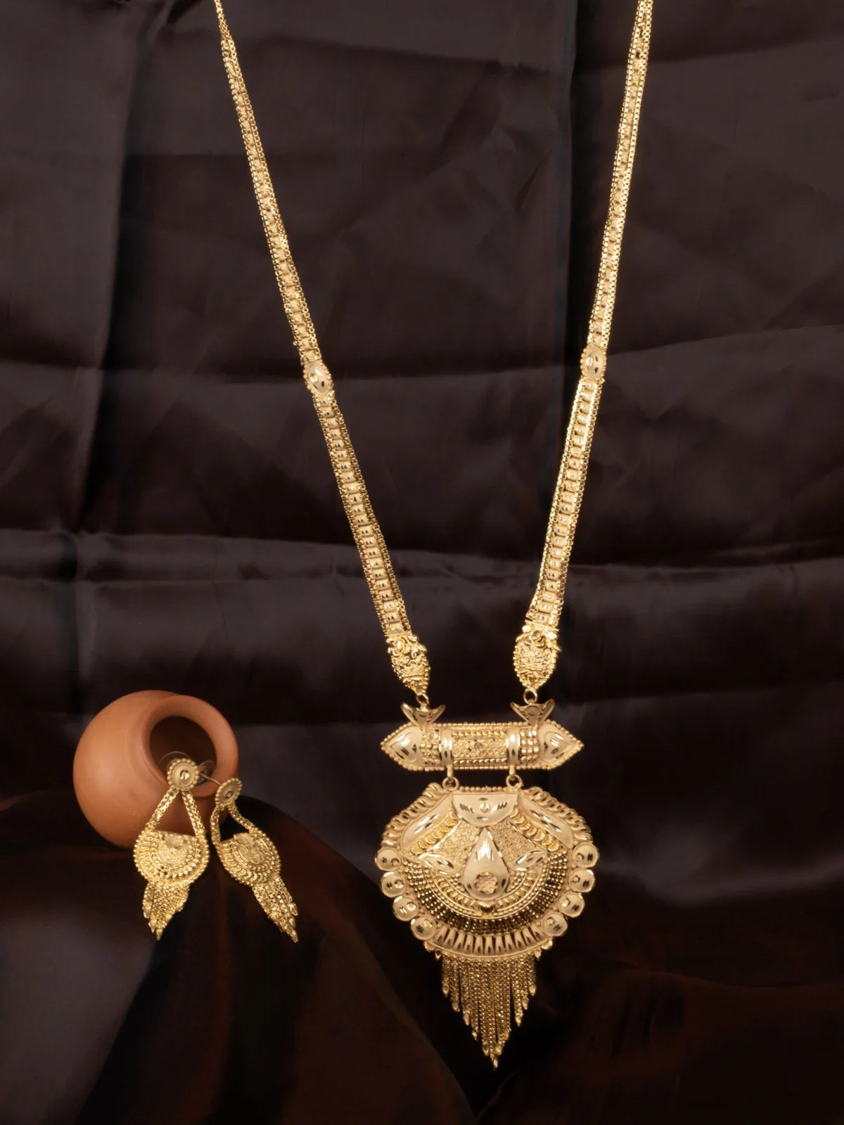 Tarani designer gold plated necklace set with earrings for weddings and festive occasions