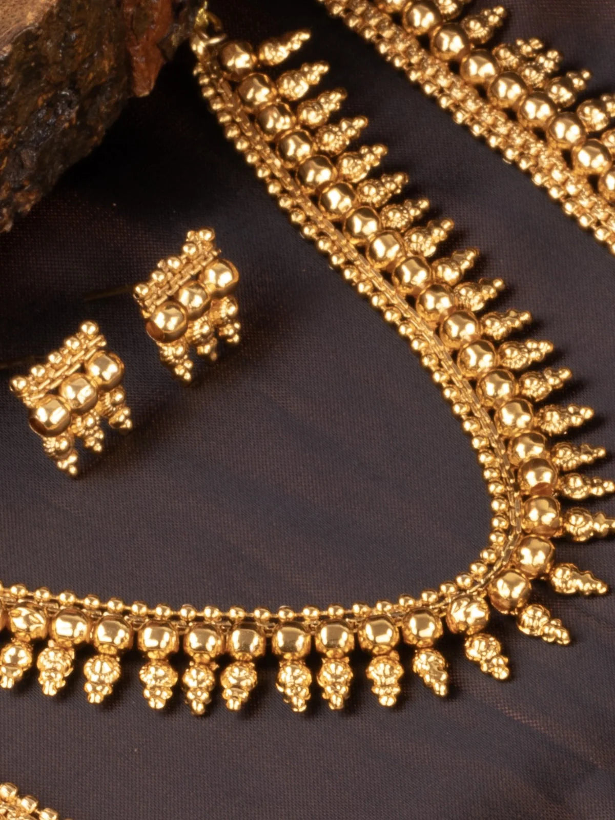 Tarani necklace set with earrings displayed in elegant festive style