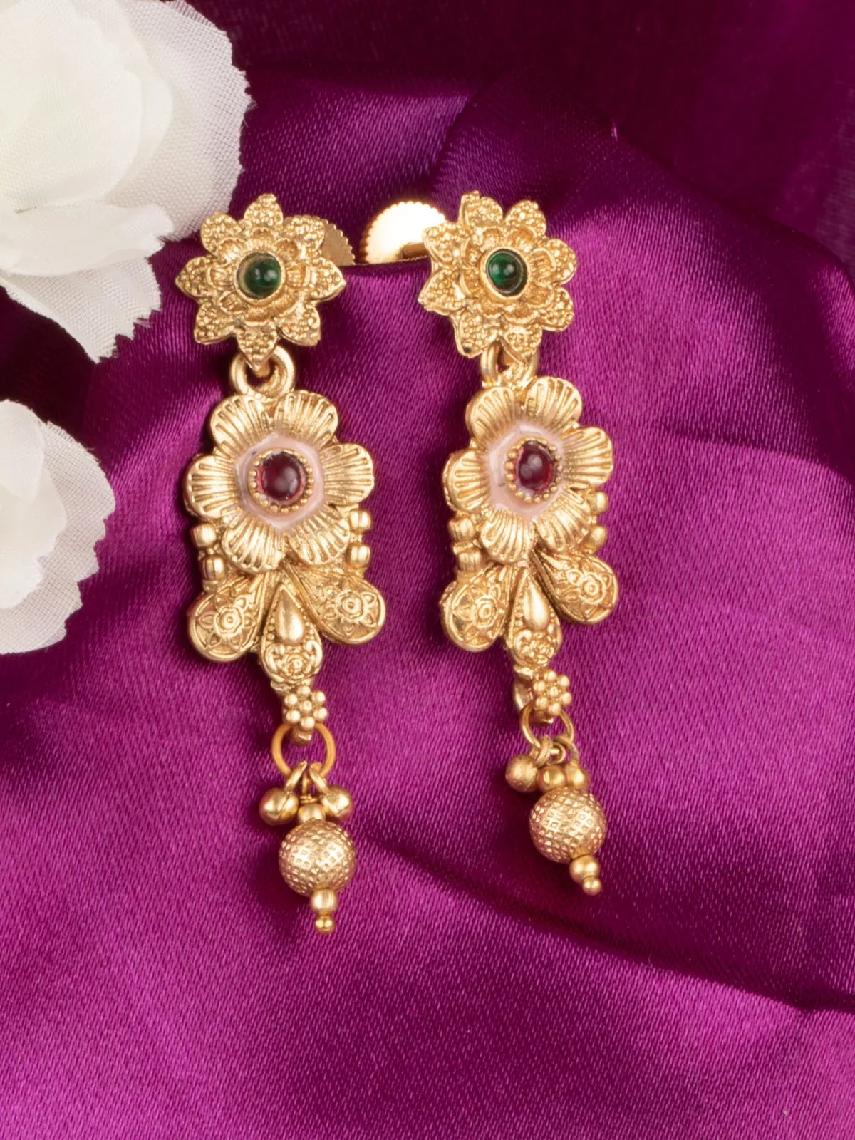 Tarani gold plated stone studded long earrings with floral design for festive wear