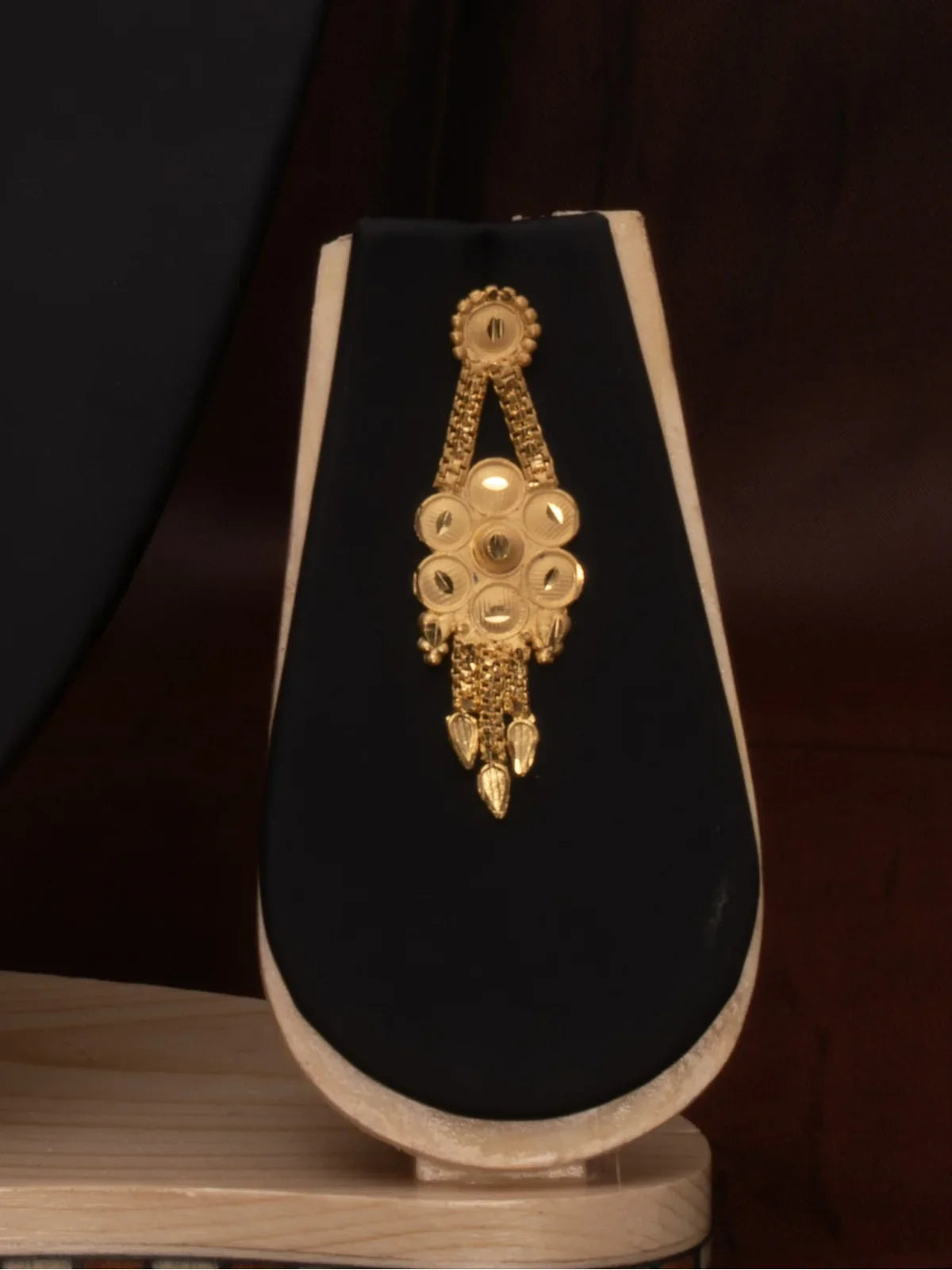 Tarani side view of gold plated necklace set highlighting intricate floral design