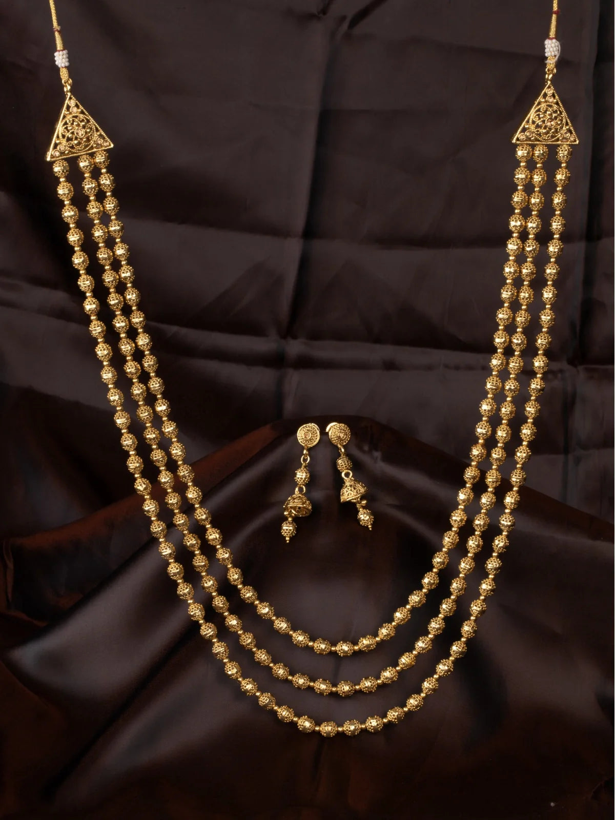 Tarani designer gold plated triple layer necklace set with jhumka earrings for weddings
