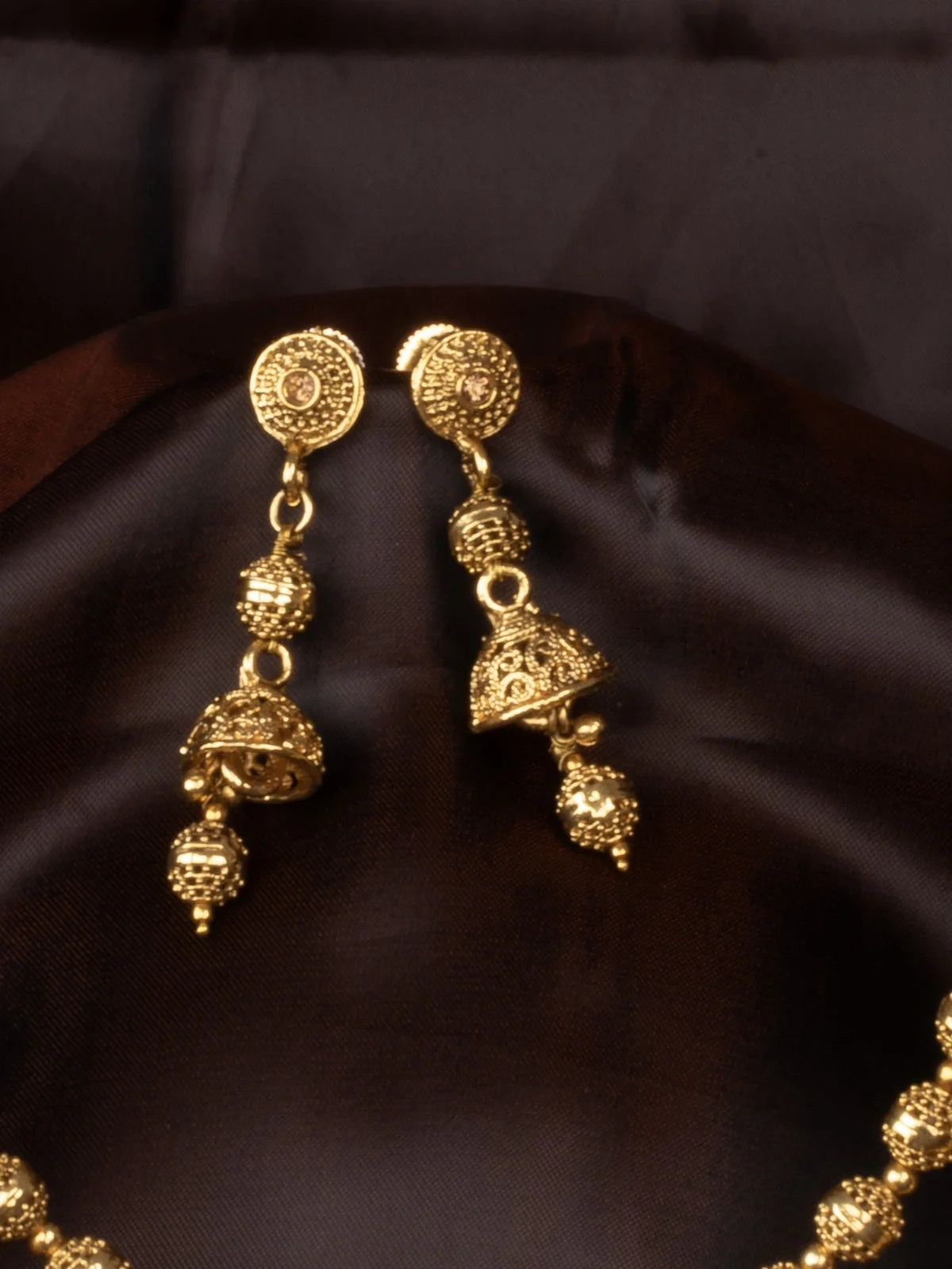 Tarani gold plated necklace set with earrings styled for festive and traditional occasions