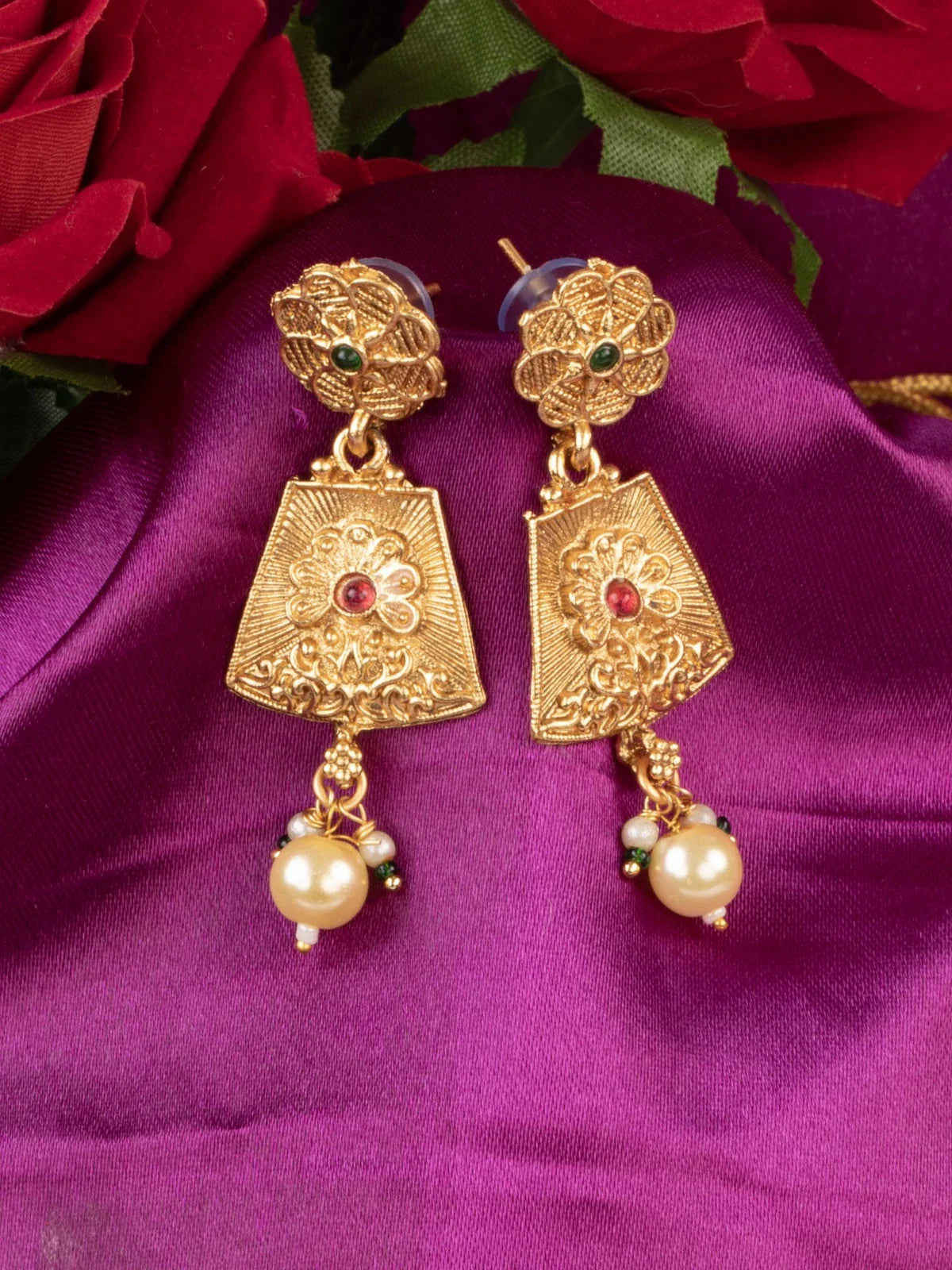 Tarani gold plated earrings with red and green stone work matching necklace set for party and festive wear