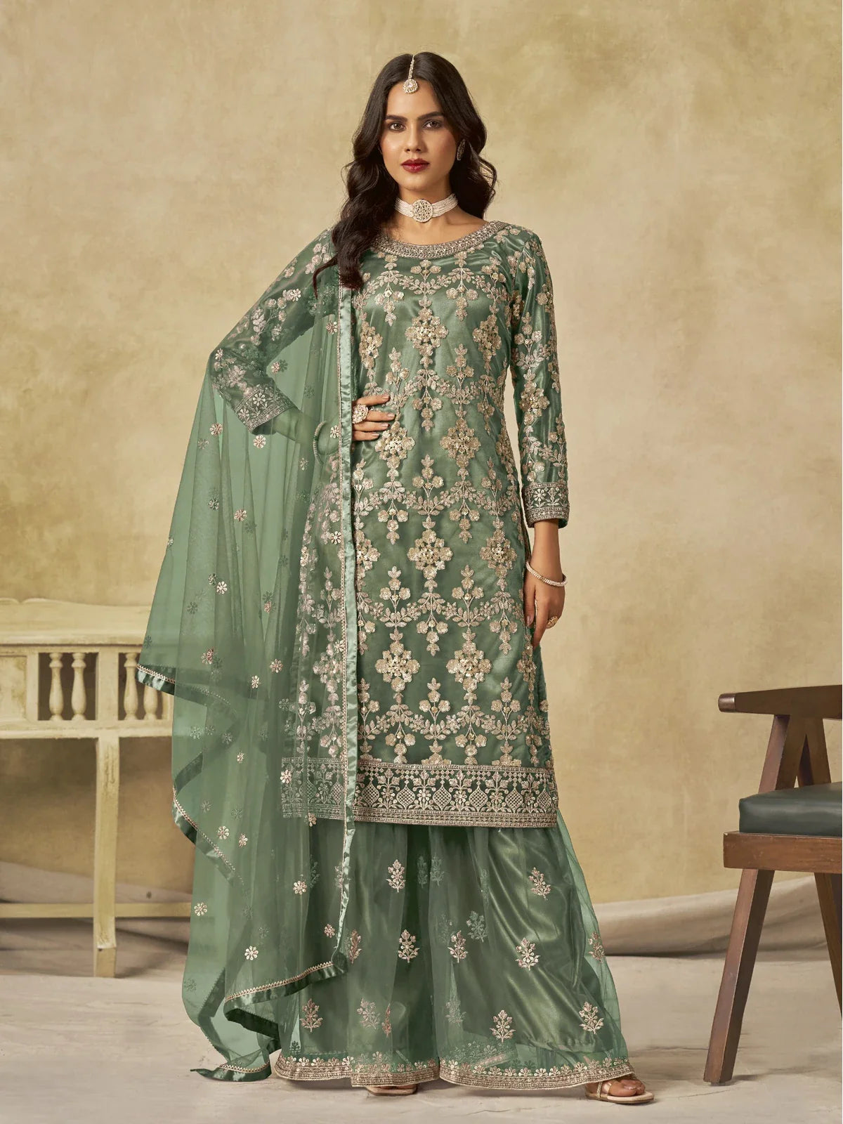 Tarani premium green net embroidered sharara palazzo suit with zari and sequins work for weddings