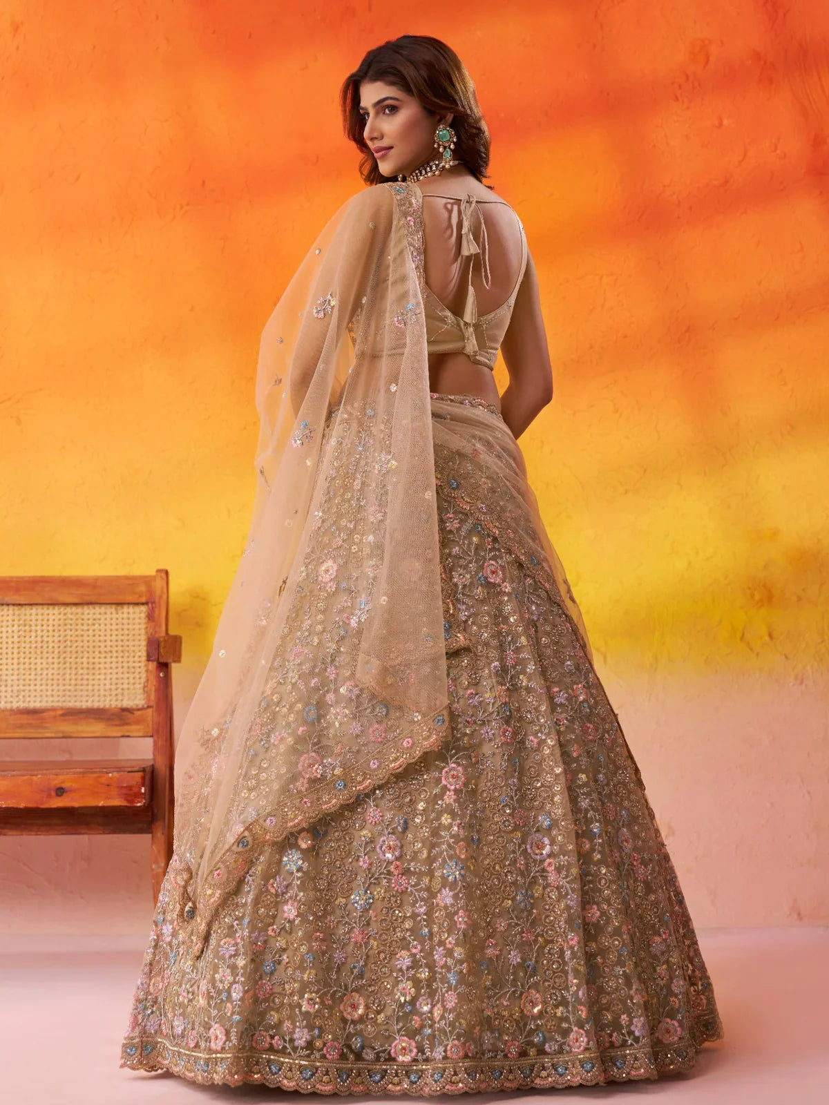 Back blouse design of Tarani beige lehenga with tie-up style and floral dupatta embroidery