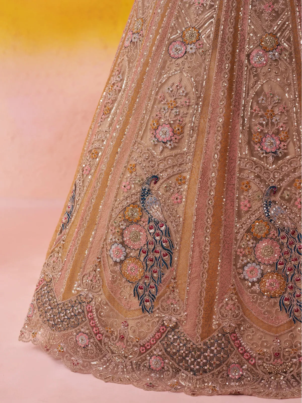 Tarani closeup view of lehenga border with peacock embroidery and threadwork detailing
