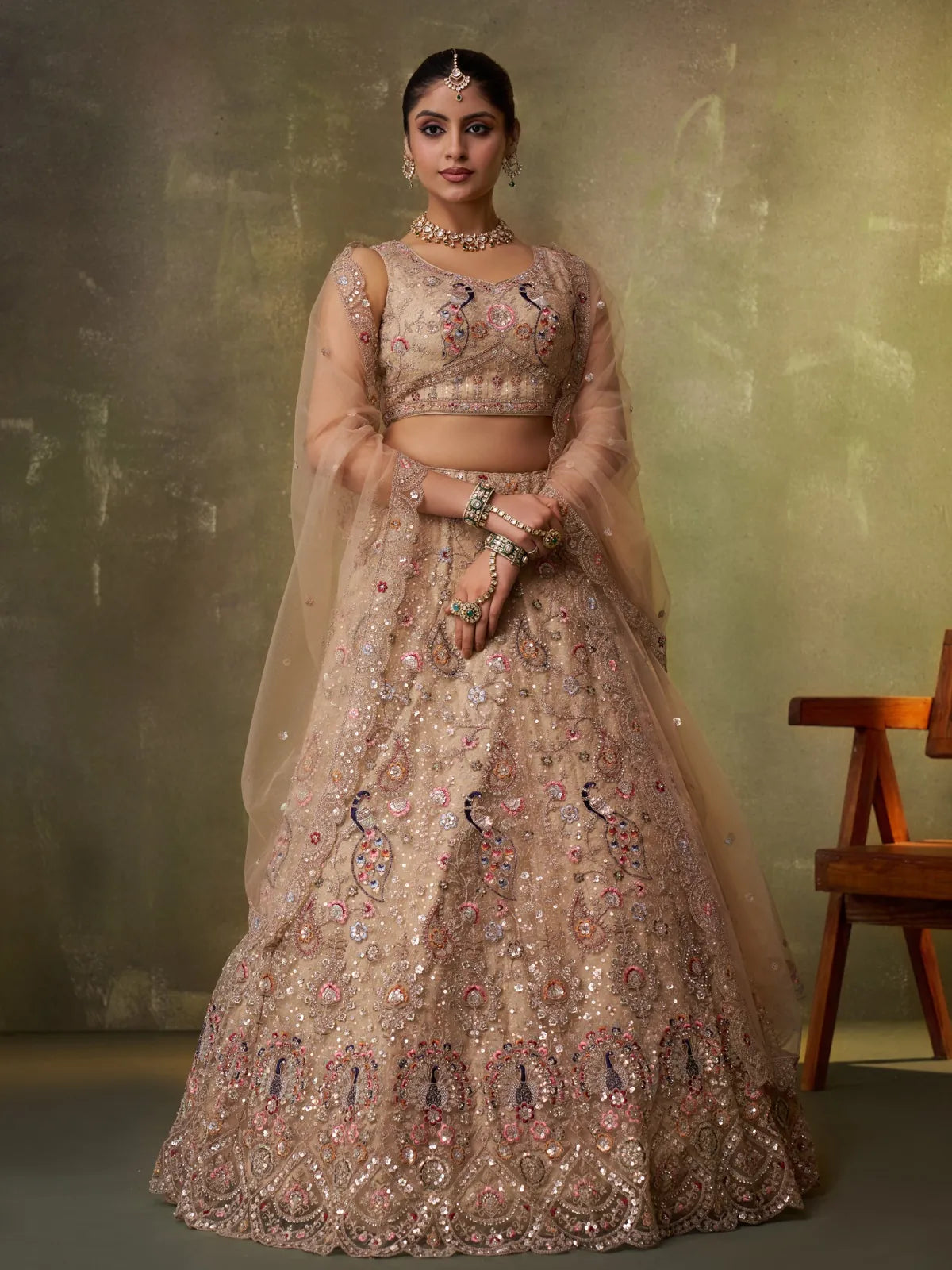 Tarani beige net full view lehenga with sequins and peacock embroidery for wedding wear
