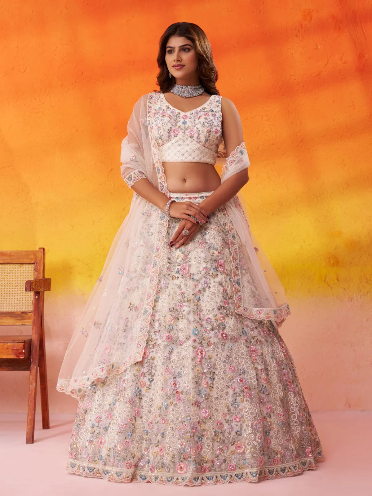 Tarani beige net lehenga with full flair and sequin embroidery for weddings – front full view