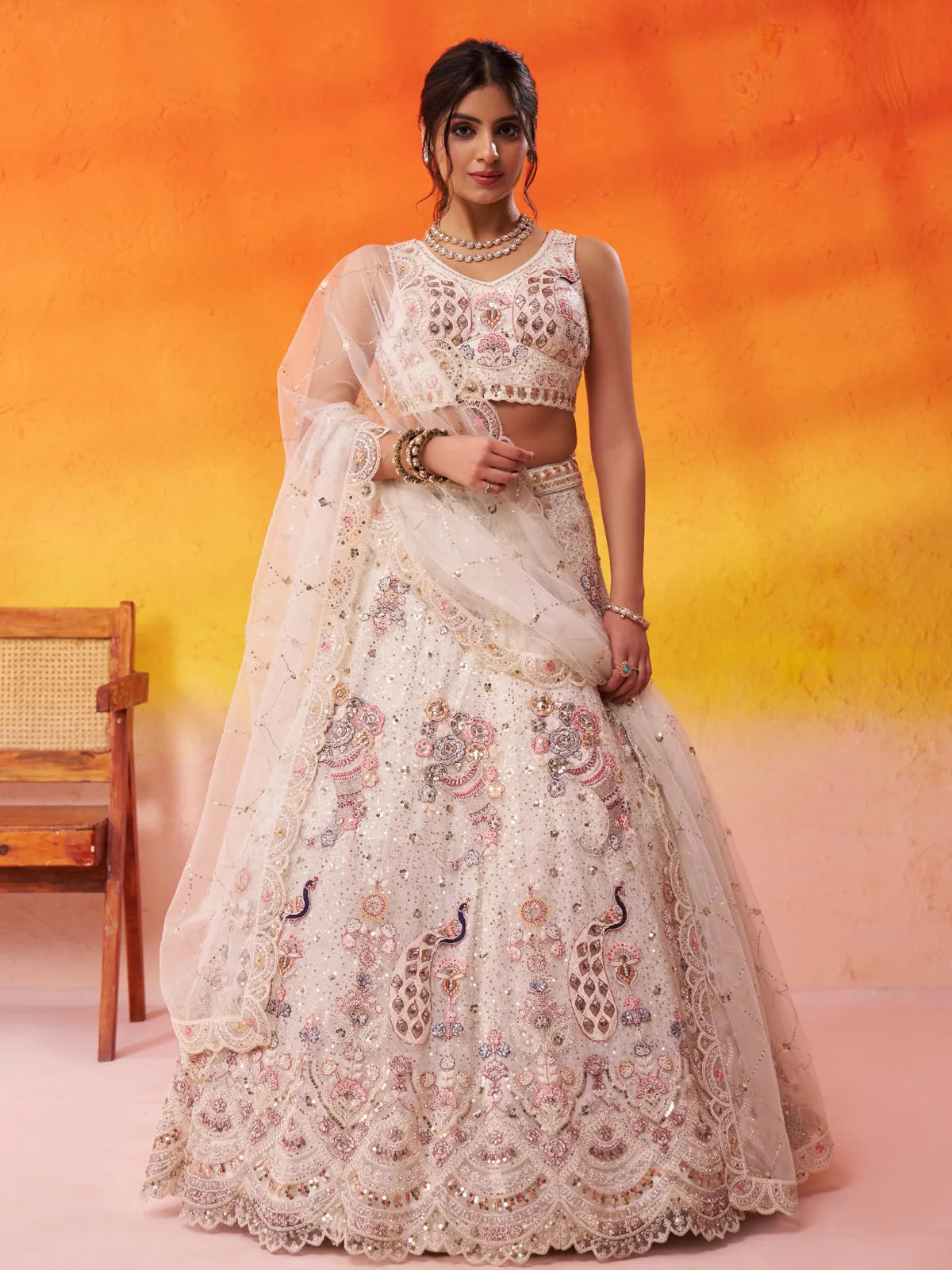 Tarani cream net lehenga with full view showcasing sequins embroidery and traditional detailing