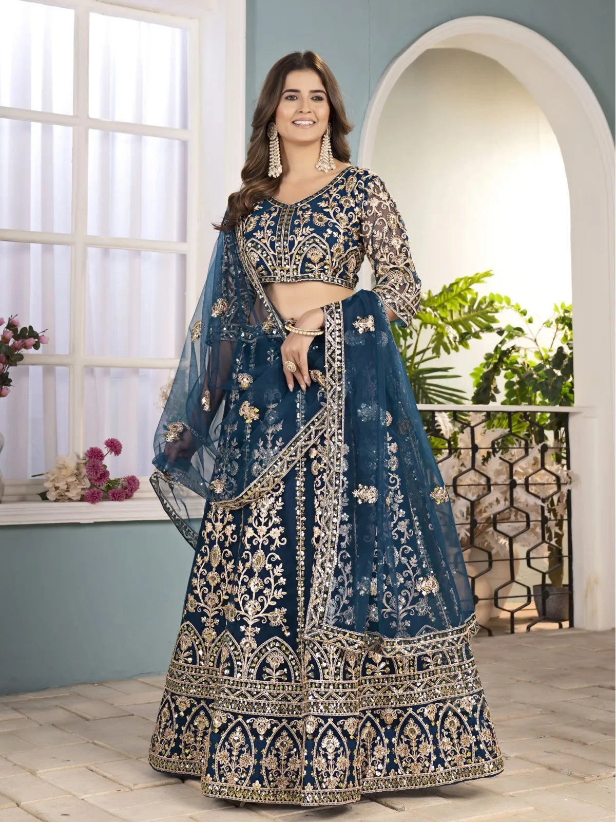 Tarani navy blue lehenga blouse design with sheer embroidered sleeves