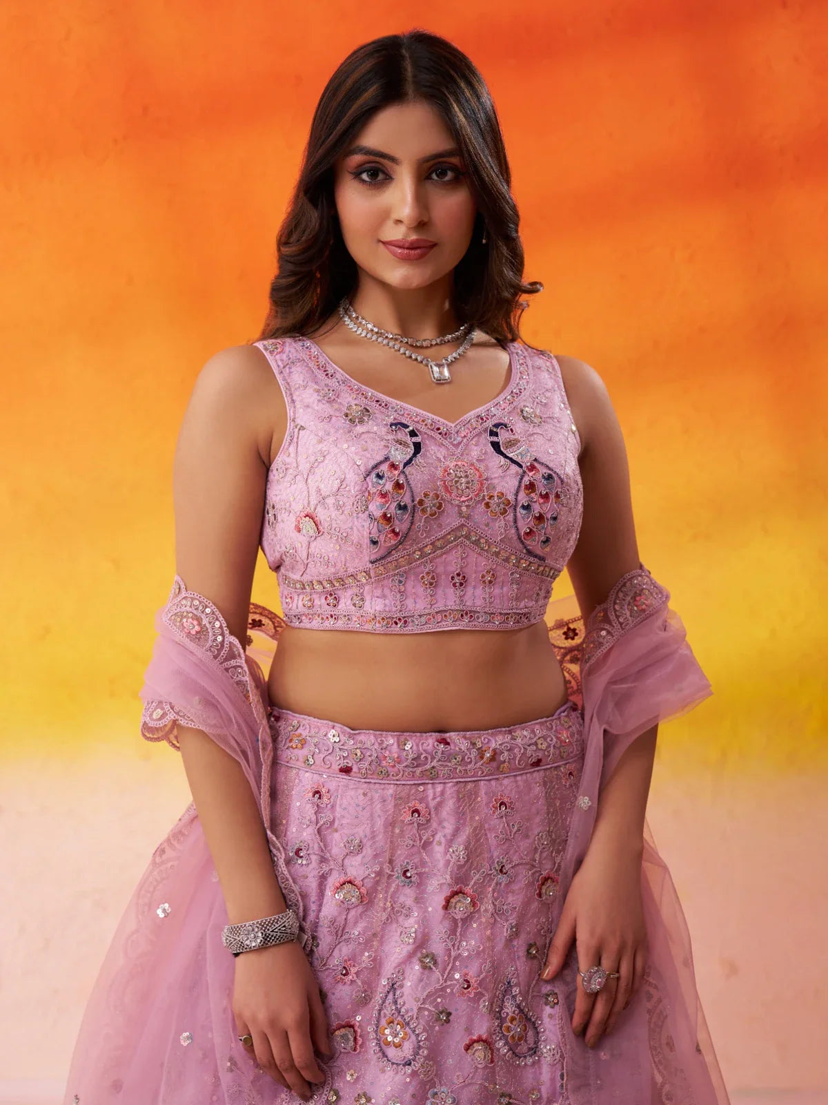 Tarani pink embroidered blouse in net fabric with sweetheart neckline and elegant peacock detailing