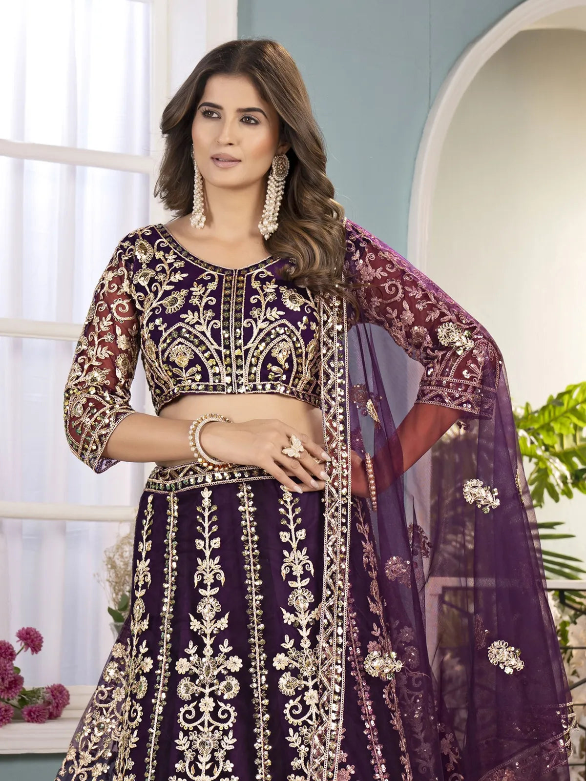 Tarani purple net lehenga front view with elegant dupatta drape