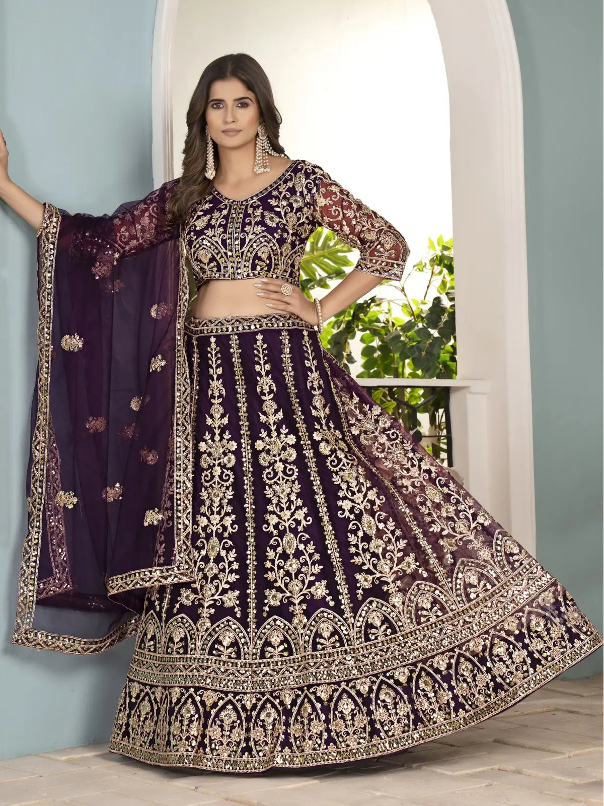 Tarani purple net lehenga full view showcasing 3 meter flair
