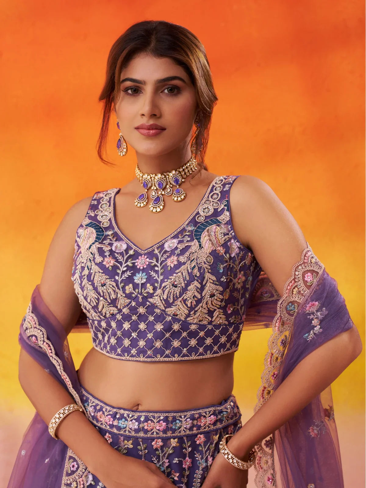 Tarani upper body view of net lehenga showing embroidered blouse and dupatta