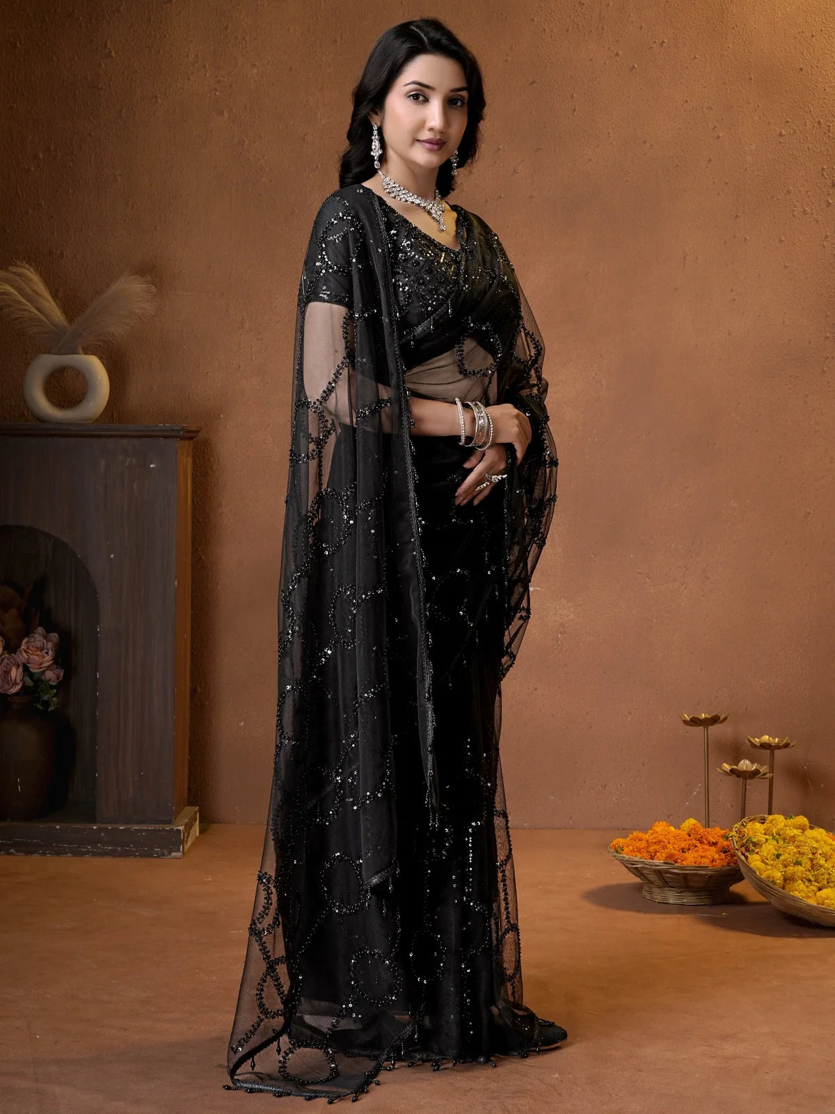 Tarani black net saree pallu view with intricate beads and sequence embroidery