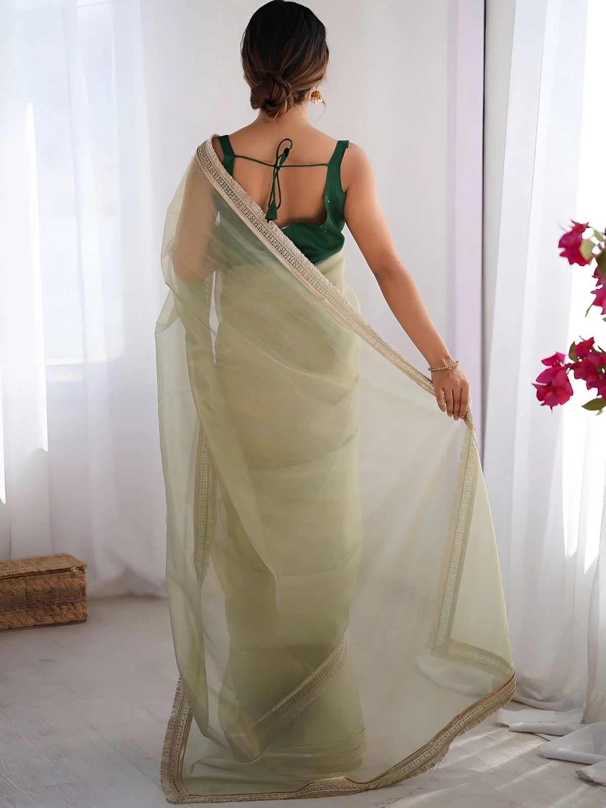 Tarani golden net saree back blouse view with tied back mono banglory blouse and soft gold drape