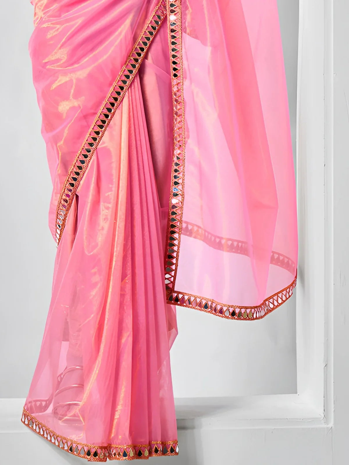 Tarani pink net saree closeup pallu view showing mirror lace detailing and fabric texture