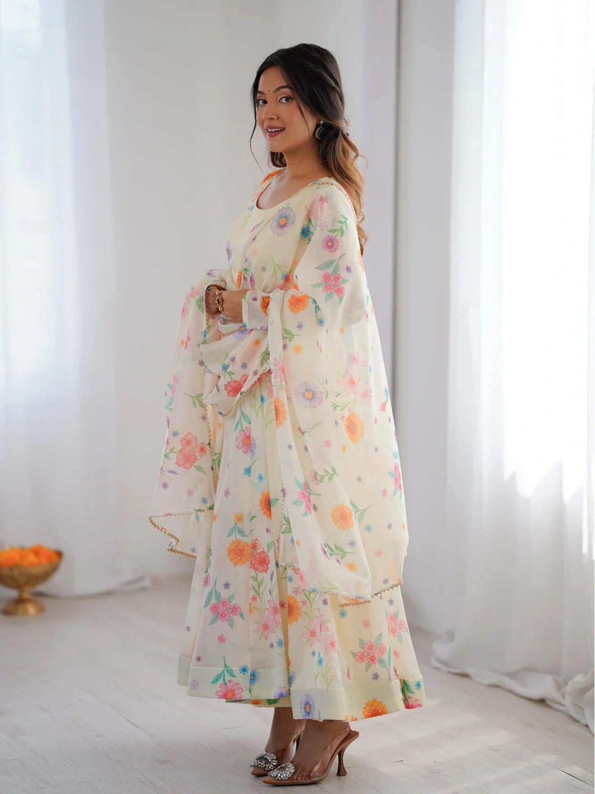 Tarani festive gown front view in soft yellow with full sleeves and printed flowers