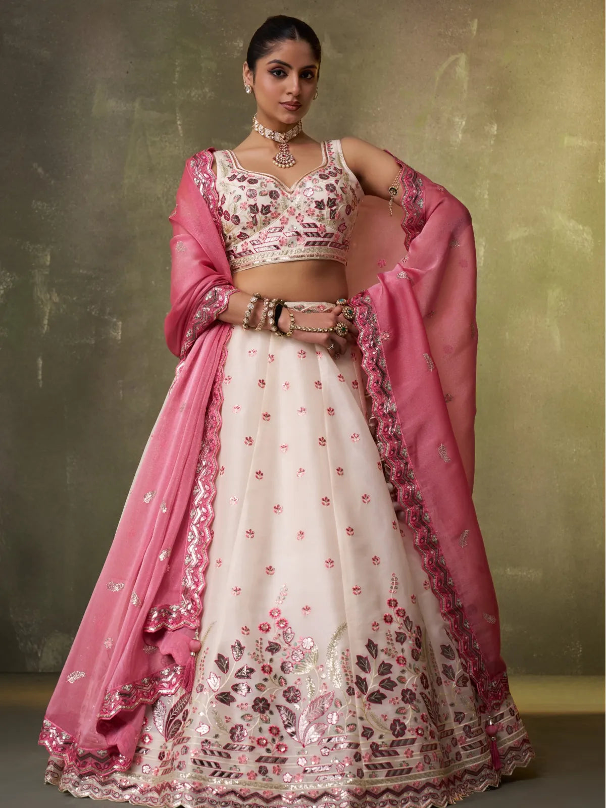 Tarani cream organza lehenga with floral embroidery and pink dupatta in full front view