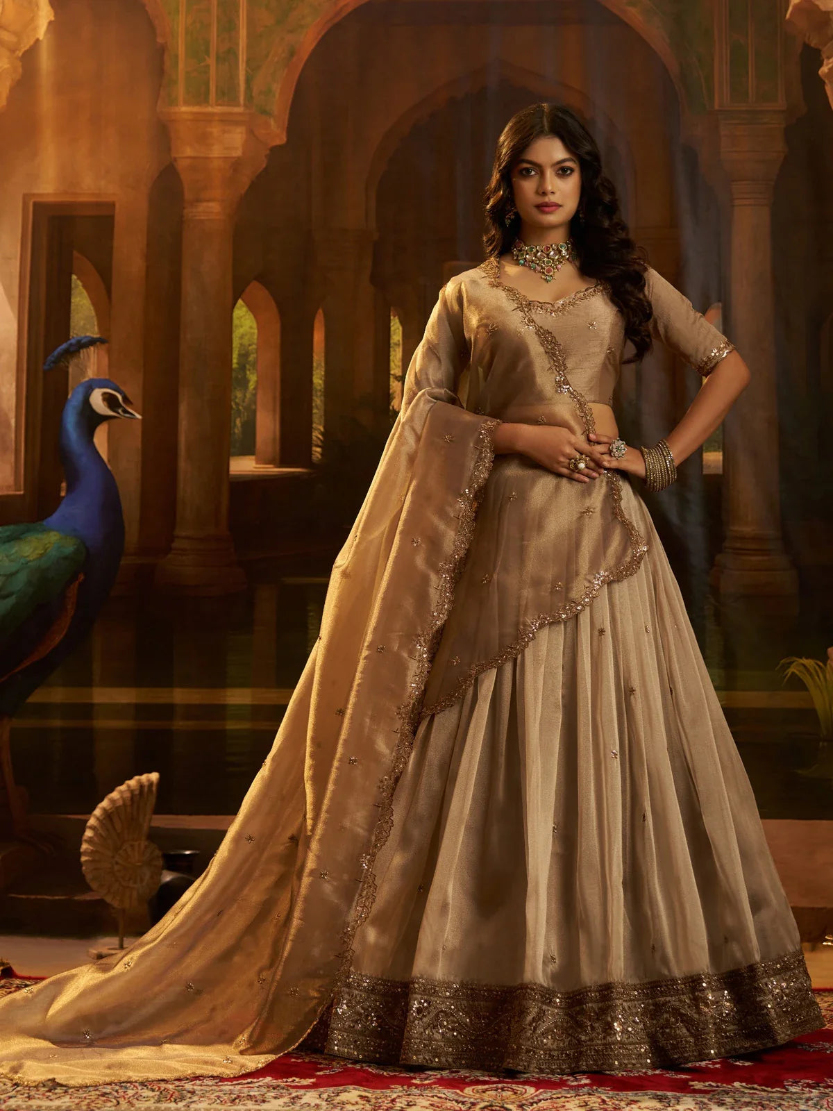 Tarani golden organza lehenga with sequin embroidery and raw silk blouse front view